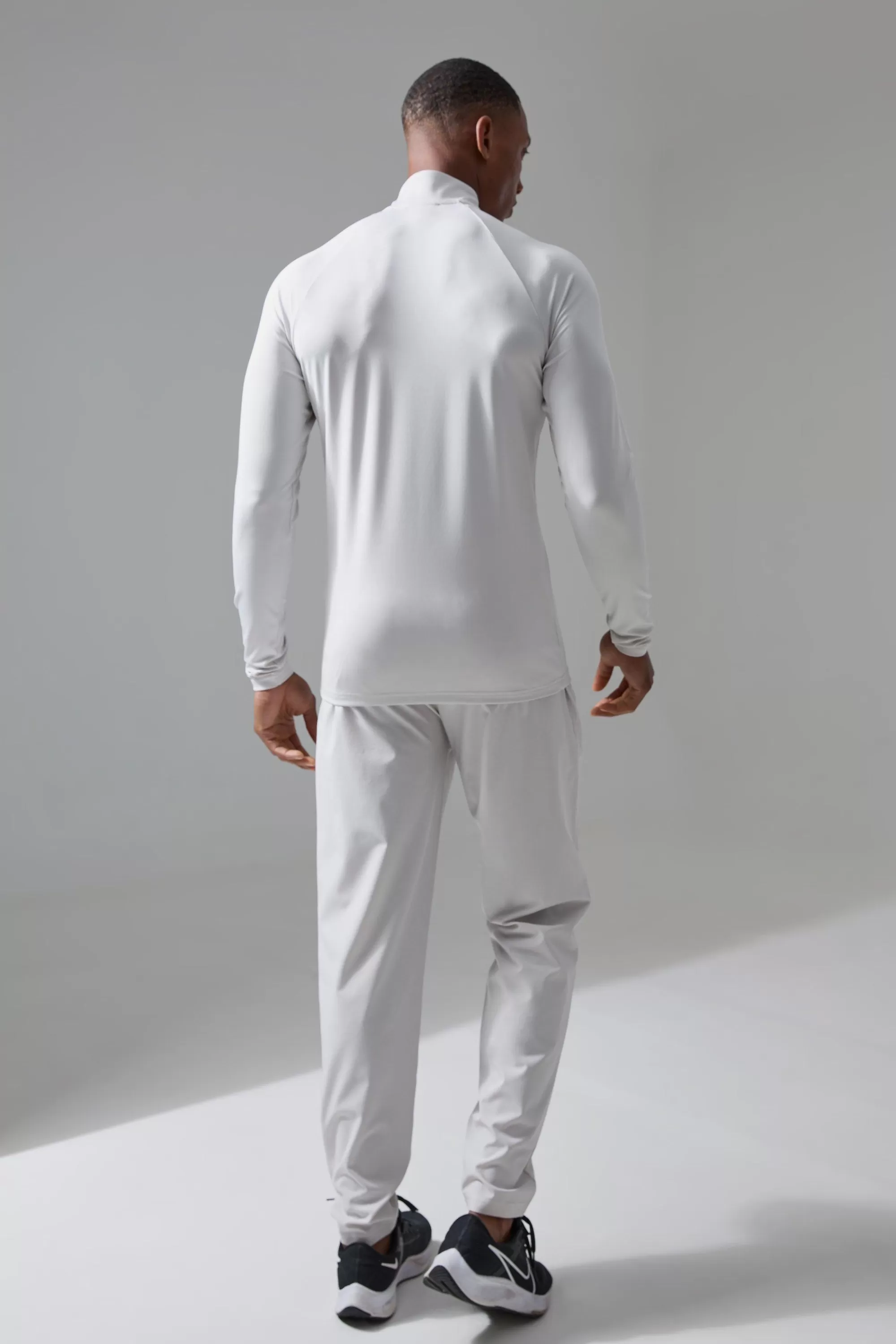 boohooMAN Active Training Dept Perforated Slim Fit 1/4 Zip Top | UK