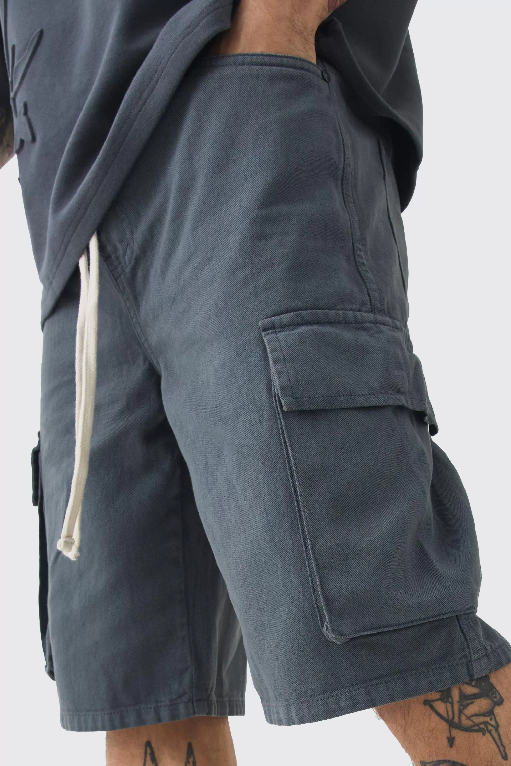 boohooMAN Baggy Fit Elasticated Waist Extended Drawcord Cargo Shorts | UK