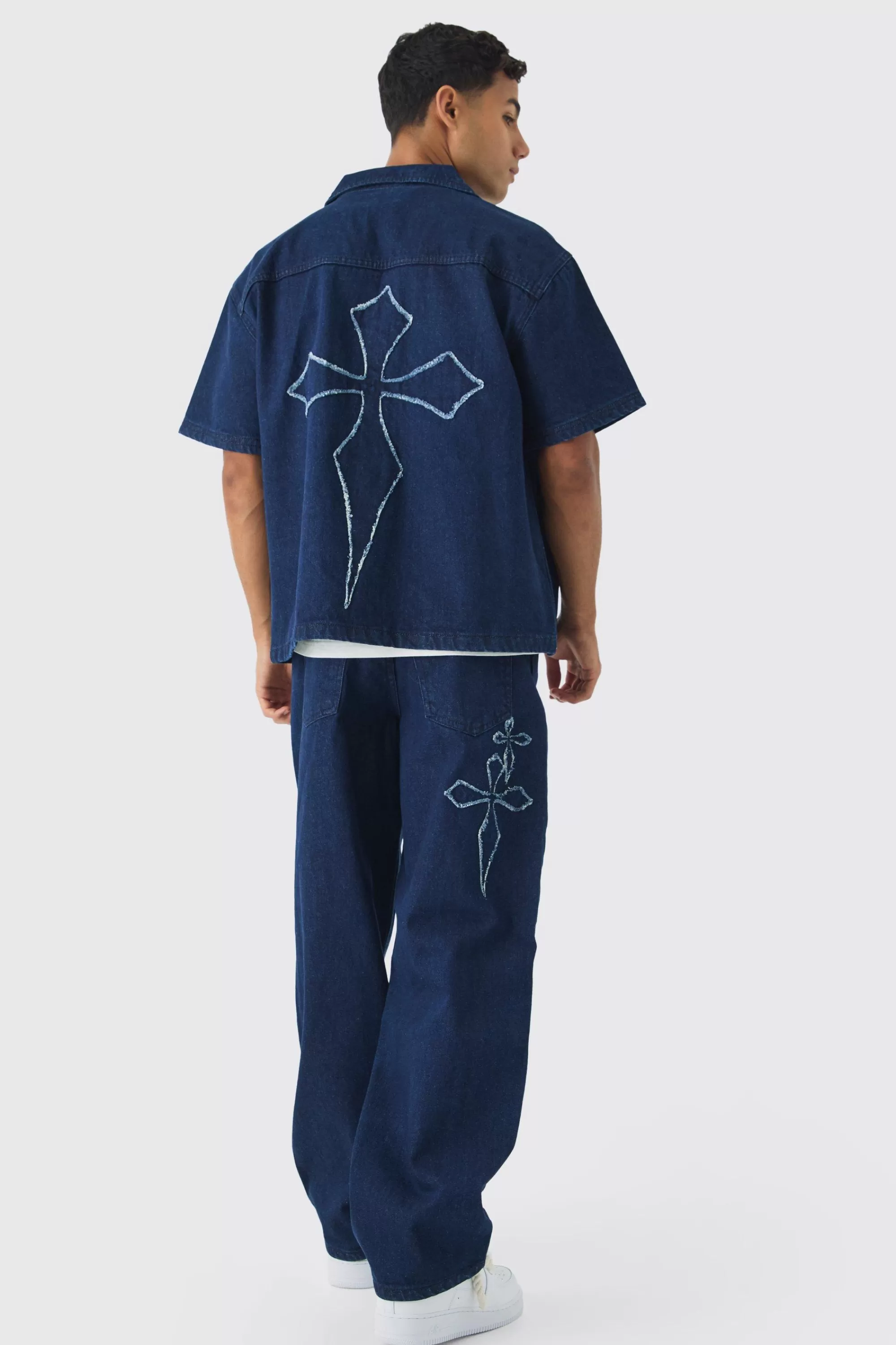boohooMAN Baggy Fit Raw Edge Denim Cross Applique Jeans | UK