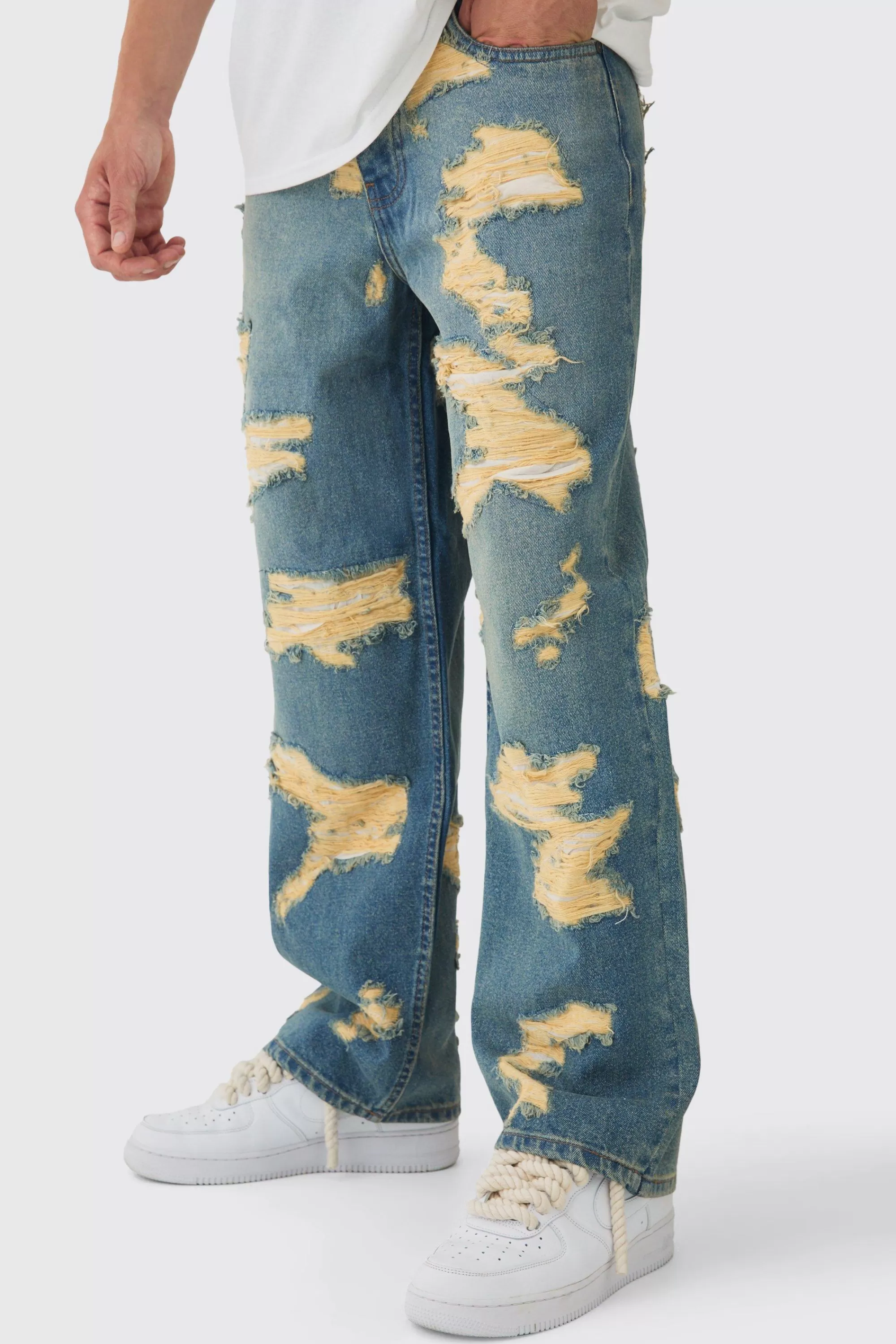 boohooMAN Baggy Fit Rigid All Over Ripped Jeans | UK