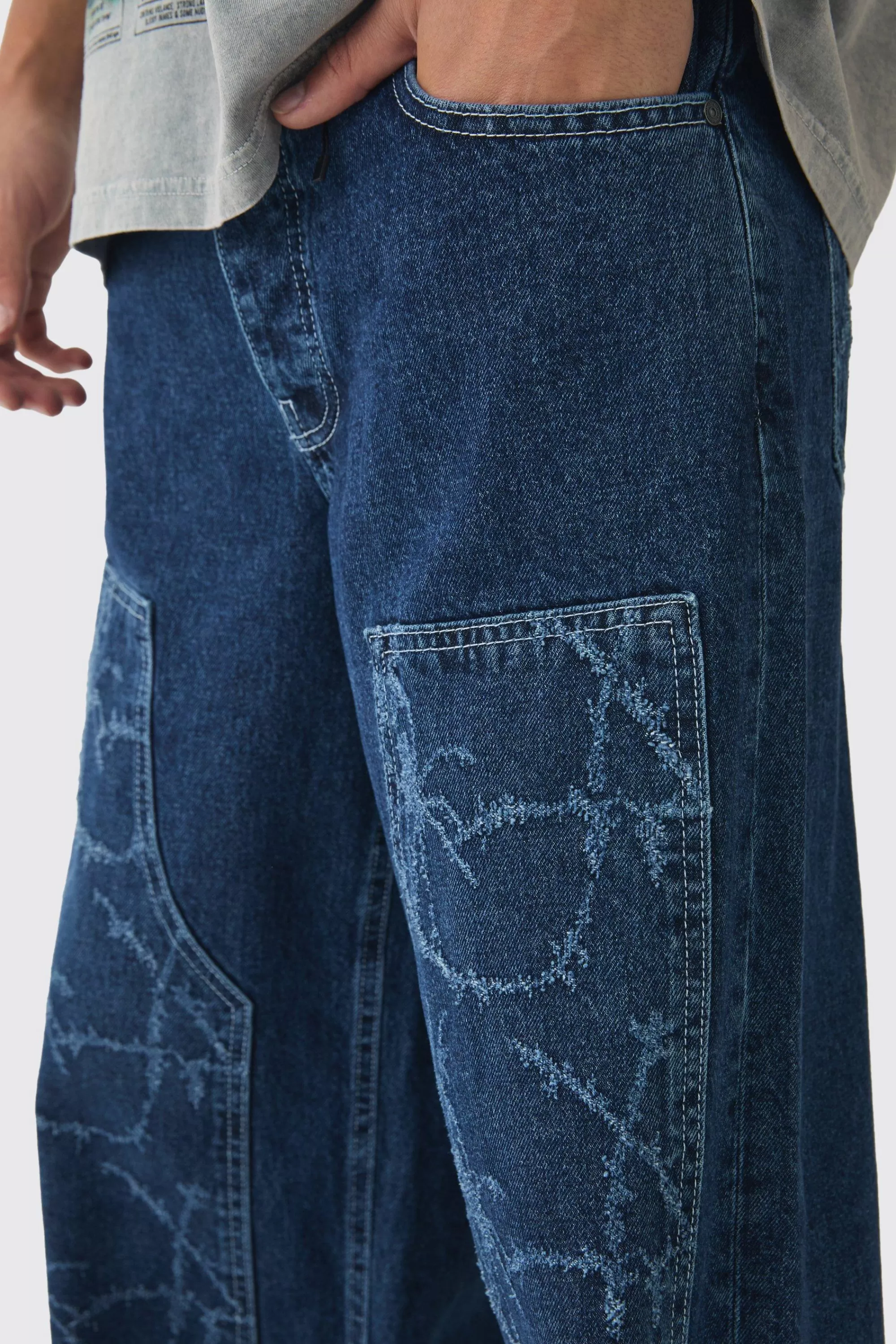 boohooMAN Baggy Fit Rigid Barbed Wire Laser Print Carpenter Jeans | UK