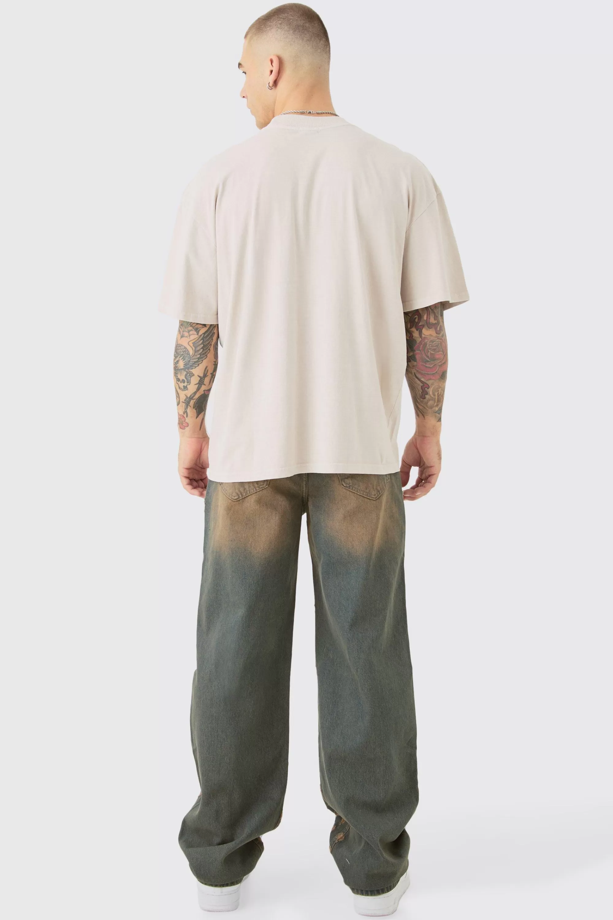 boohooMAN Baggy Rigid All Over Distressed Jeans In | UK
