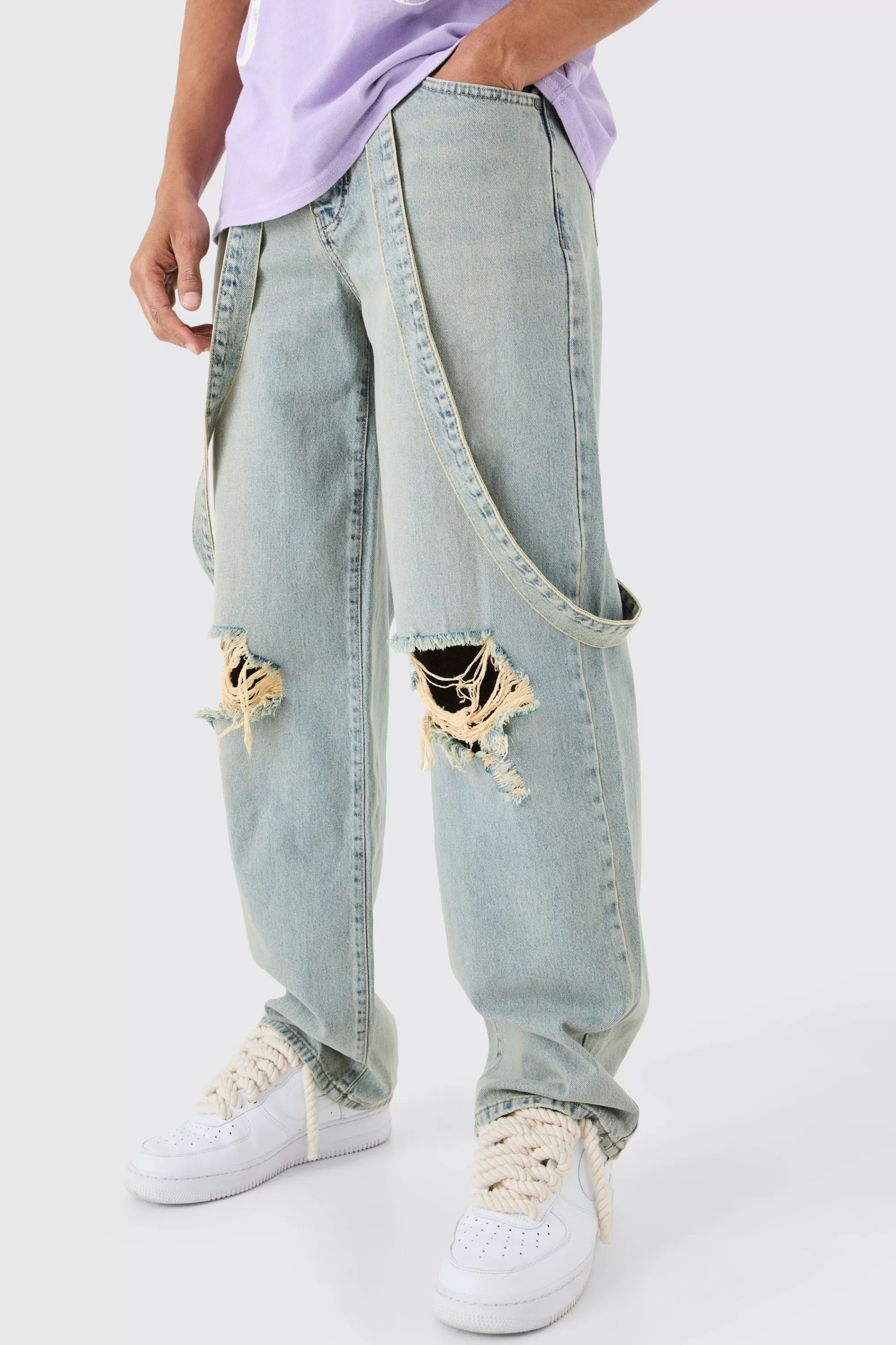 boohooMAN Baggy Rigid Strap Detail Ripped Knee Jeans In | UK