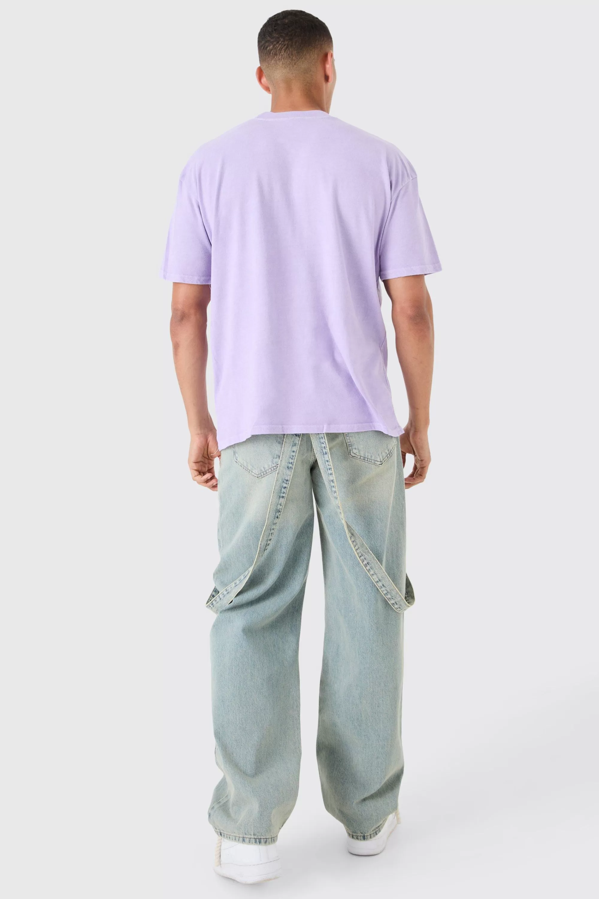 boohooMAN Baggy Rigid Strap Detail Ripped Knee Jeans In | UK