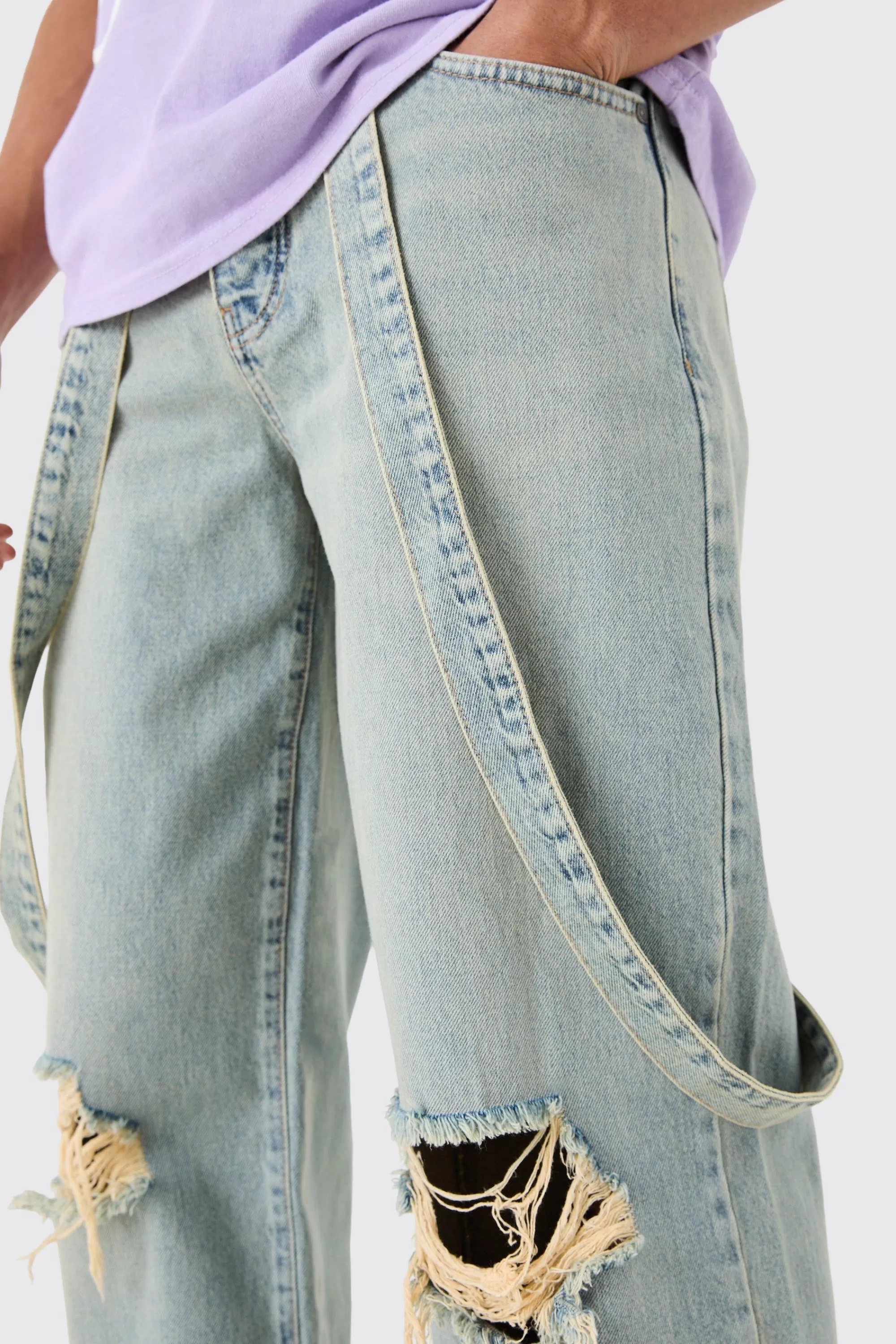 boohooMAN Baggy Rigid Strap Detail Ripped Knee Jeans In | UK