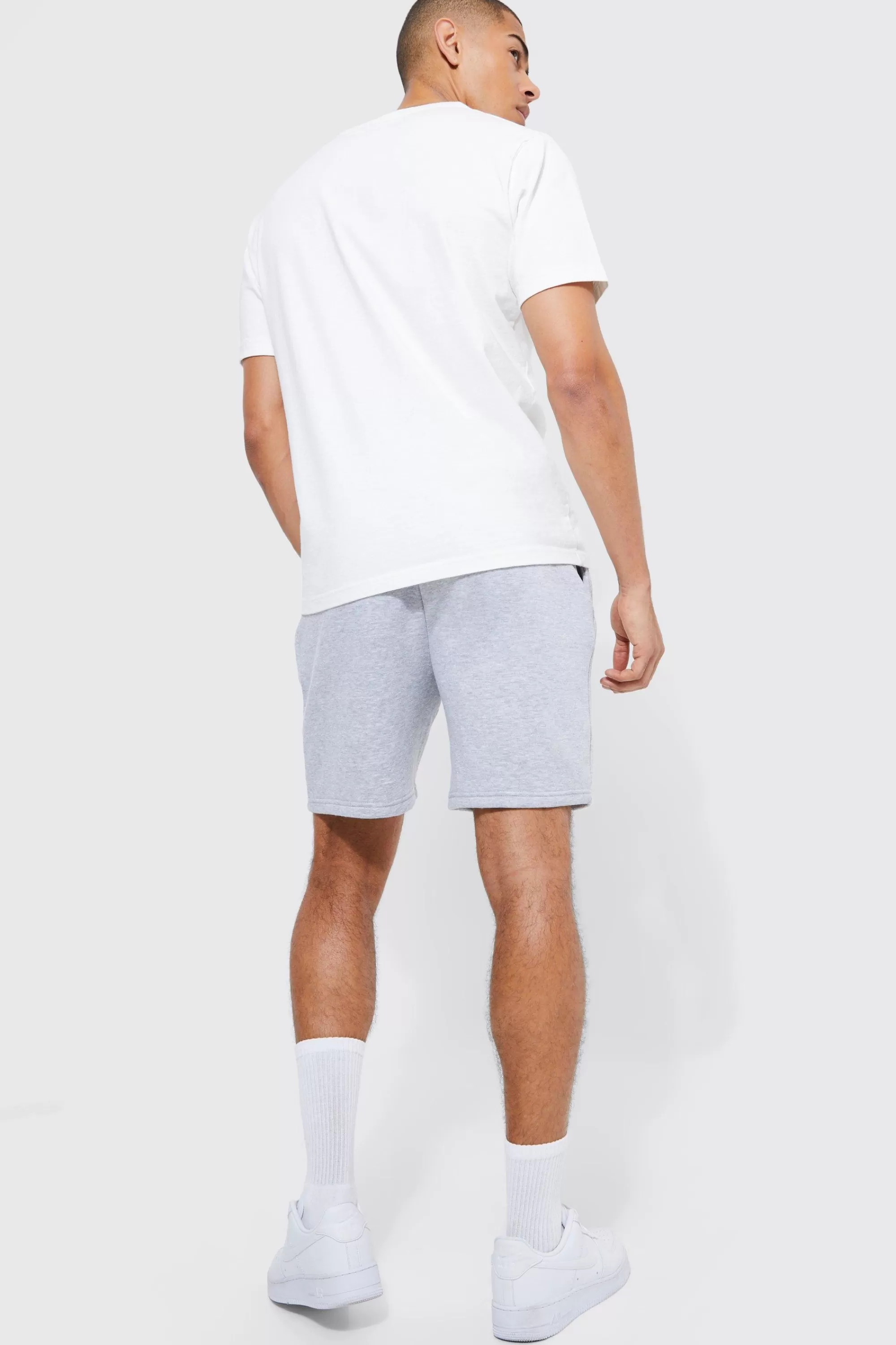 boohooMAN Basic Loose Fit Mid Length Jersey Short | UK