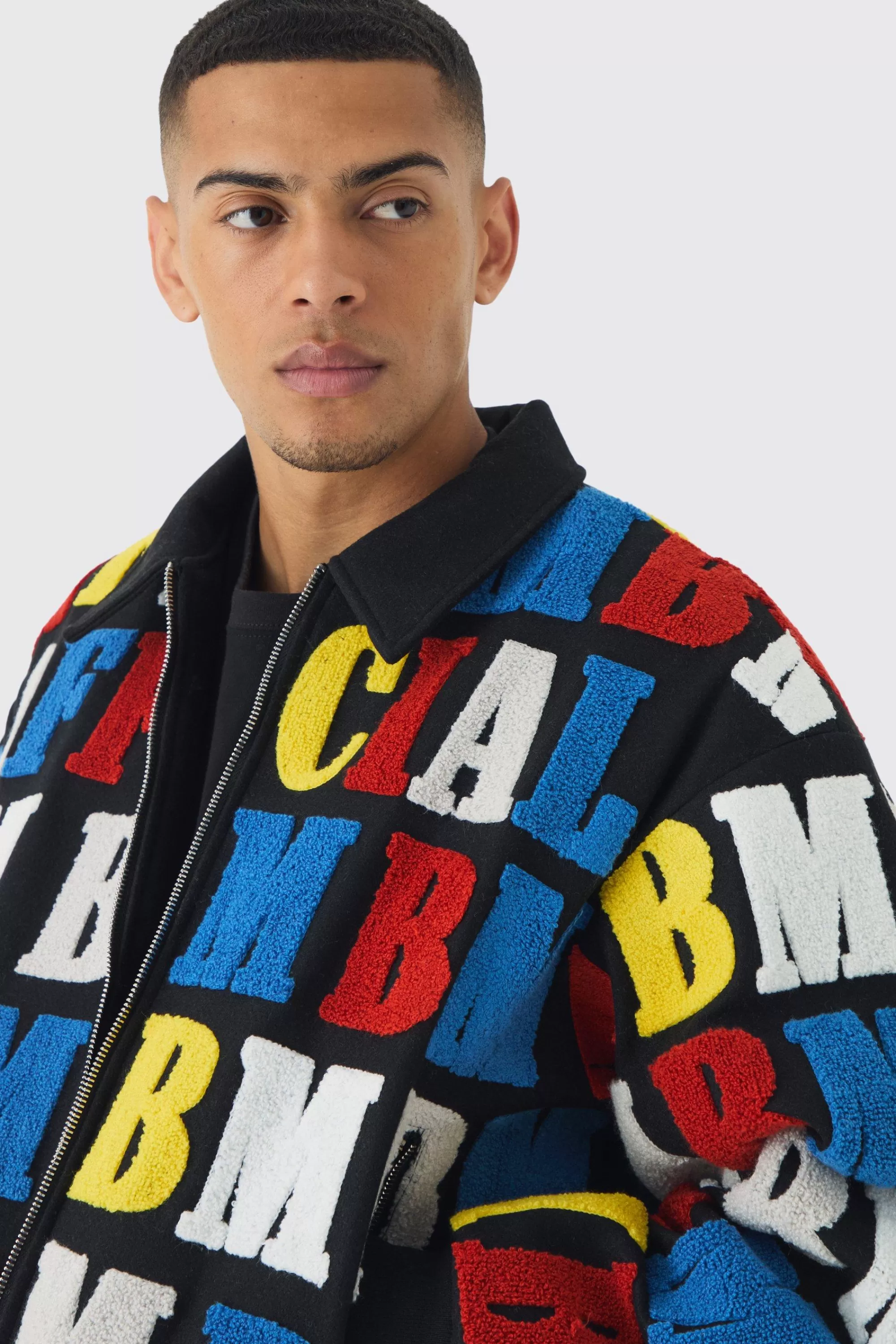 boohooMAN Boxy Letter Badge Collared Varsity Jacket In | UK
