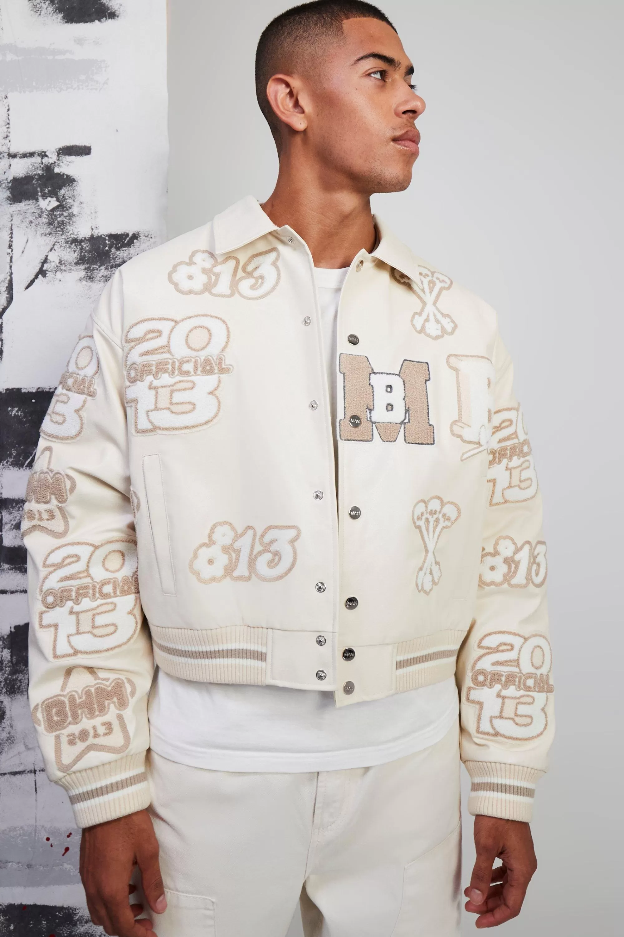 boohooMAN Boxy Pu Tonal Badge Varsity Jacket | UK