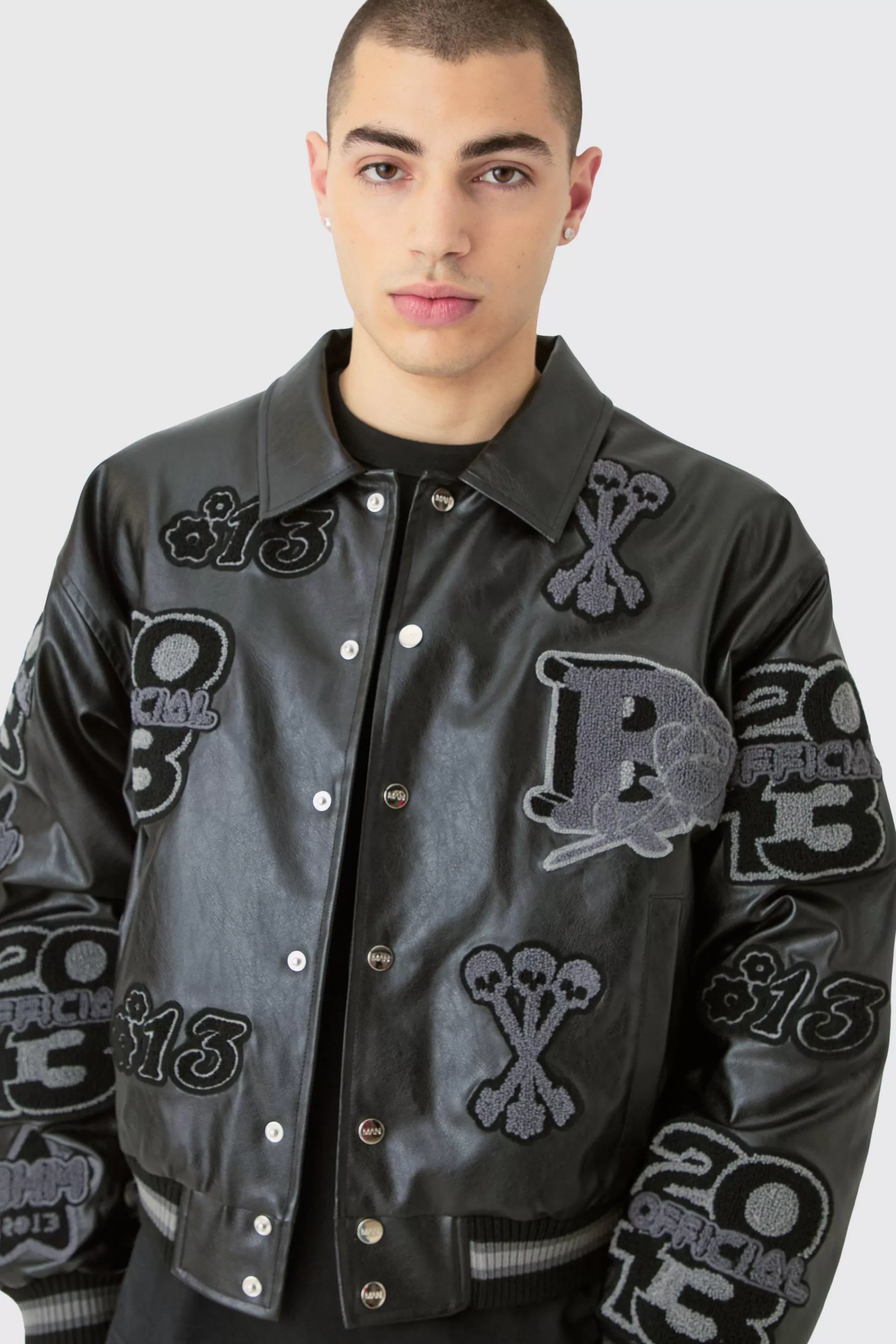 boohooMAN Boxy Pu Tonal Badge Varsity Jacket | UK