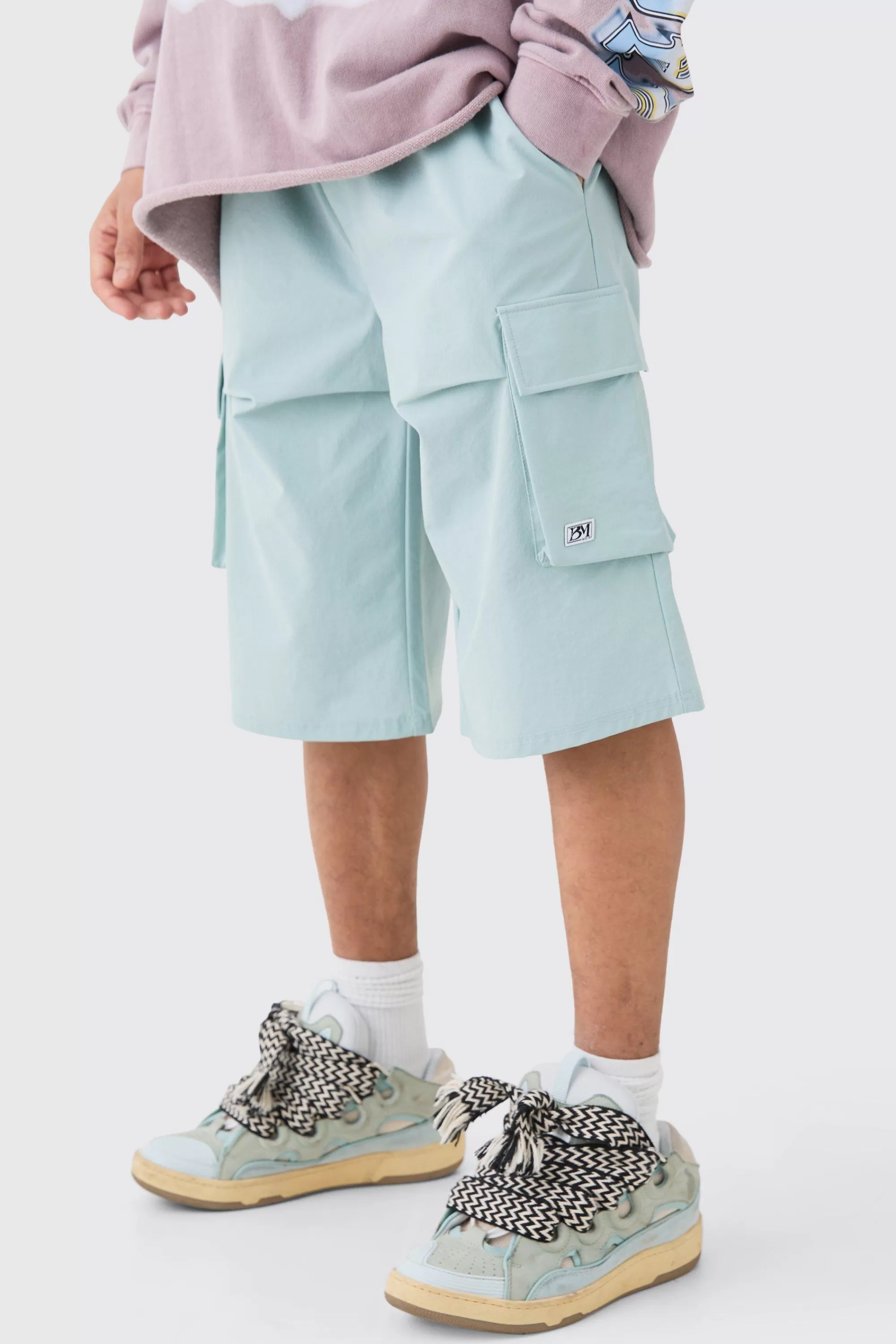 boohooMAN Elasticated Relaxed Technical Stretch Short With Branding | UK