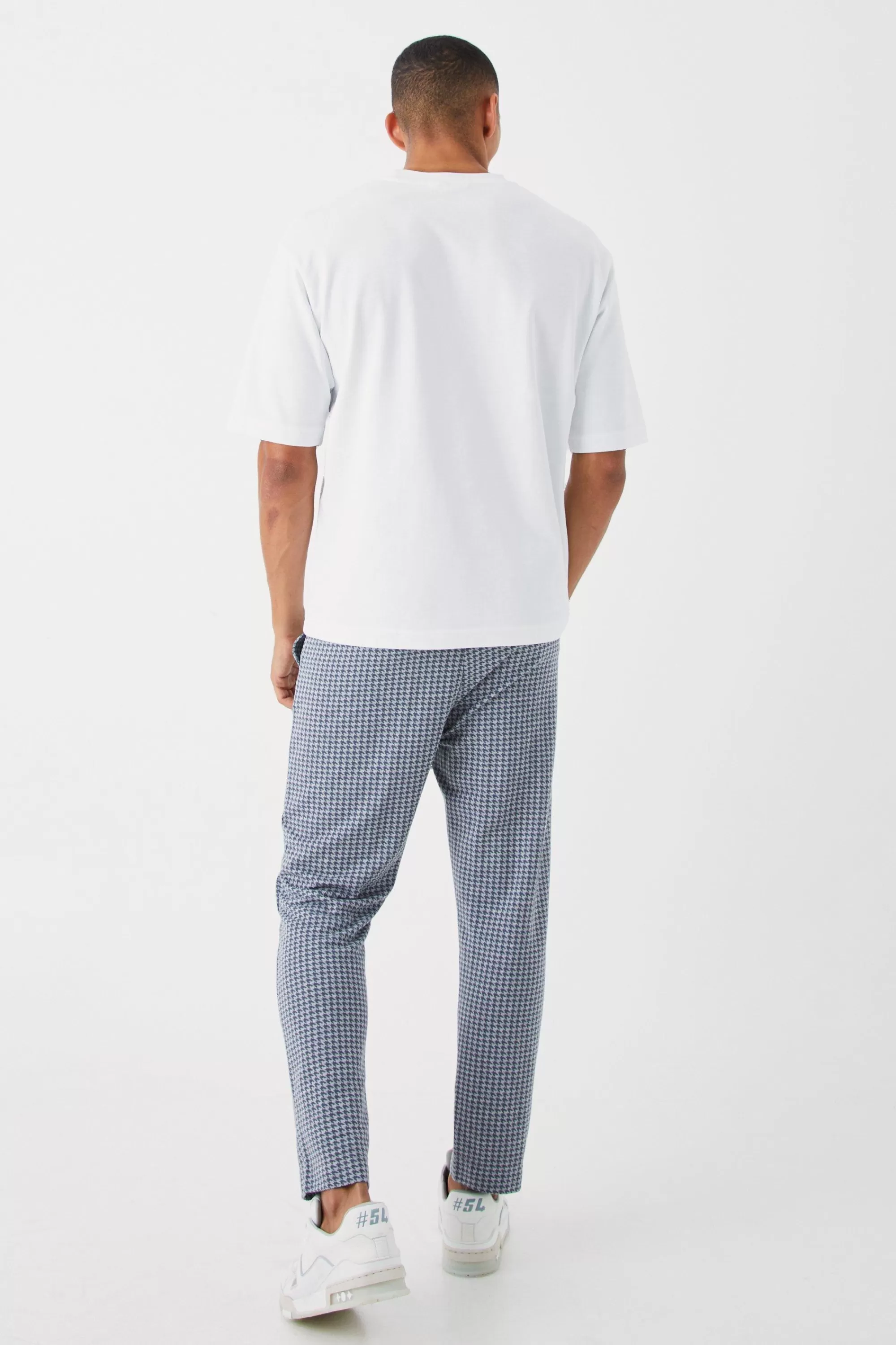 boohooMAN Elasticated Tapered Pintuck Dogstooth Trousers | UK