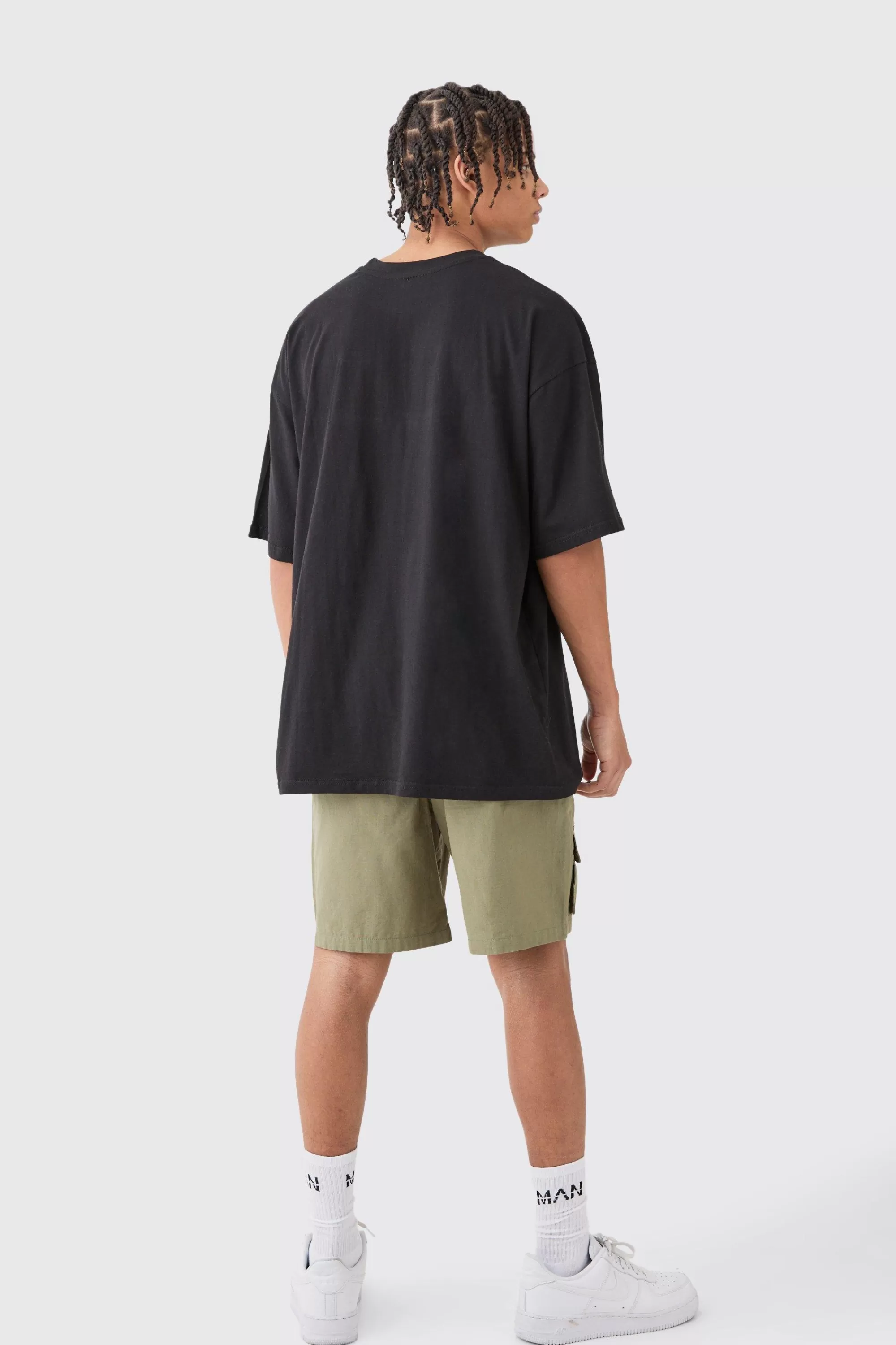 boohooMAN Elasticated Waist Detachable Bag Multi Cargo Pocket Shorts | UK