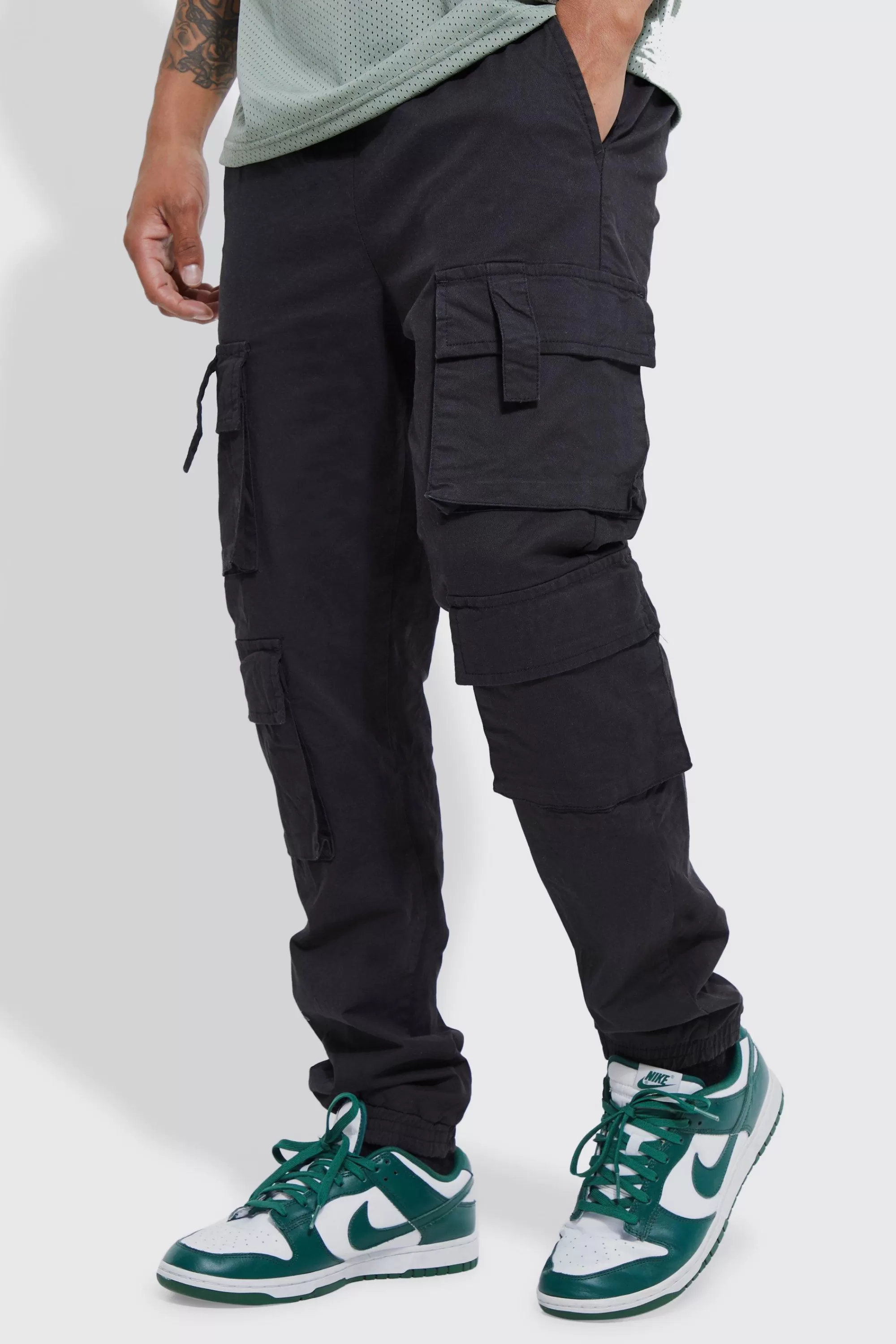 boohooMAN Elasticated Waist Multi Cargo Pocket Slim Fit Jogger | UK