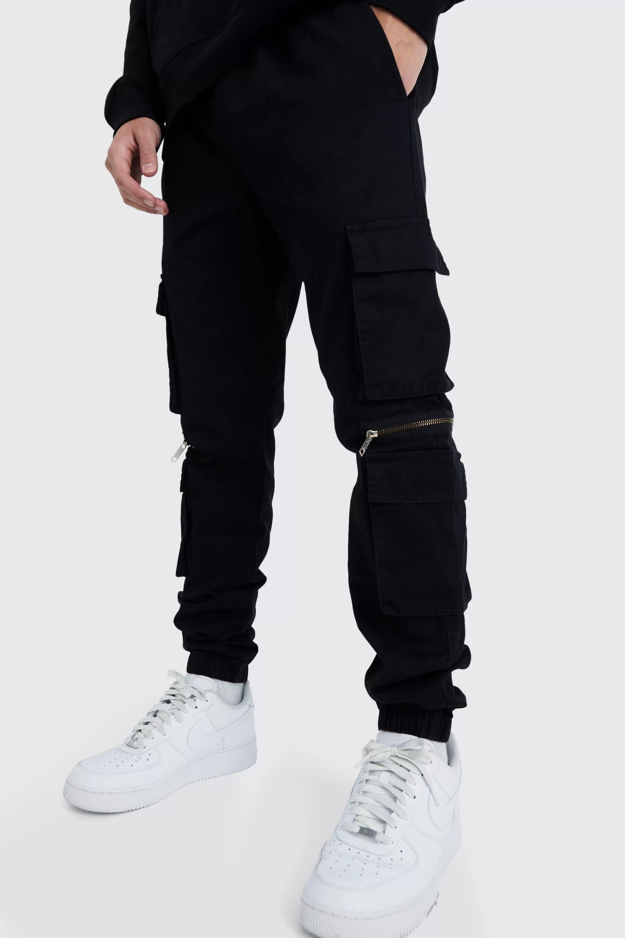 boohooMAN Elasticated Waist Multi Pocket Zip Cargo Trouser | UK