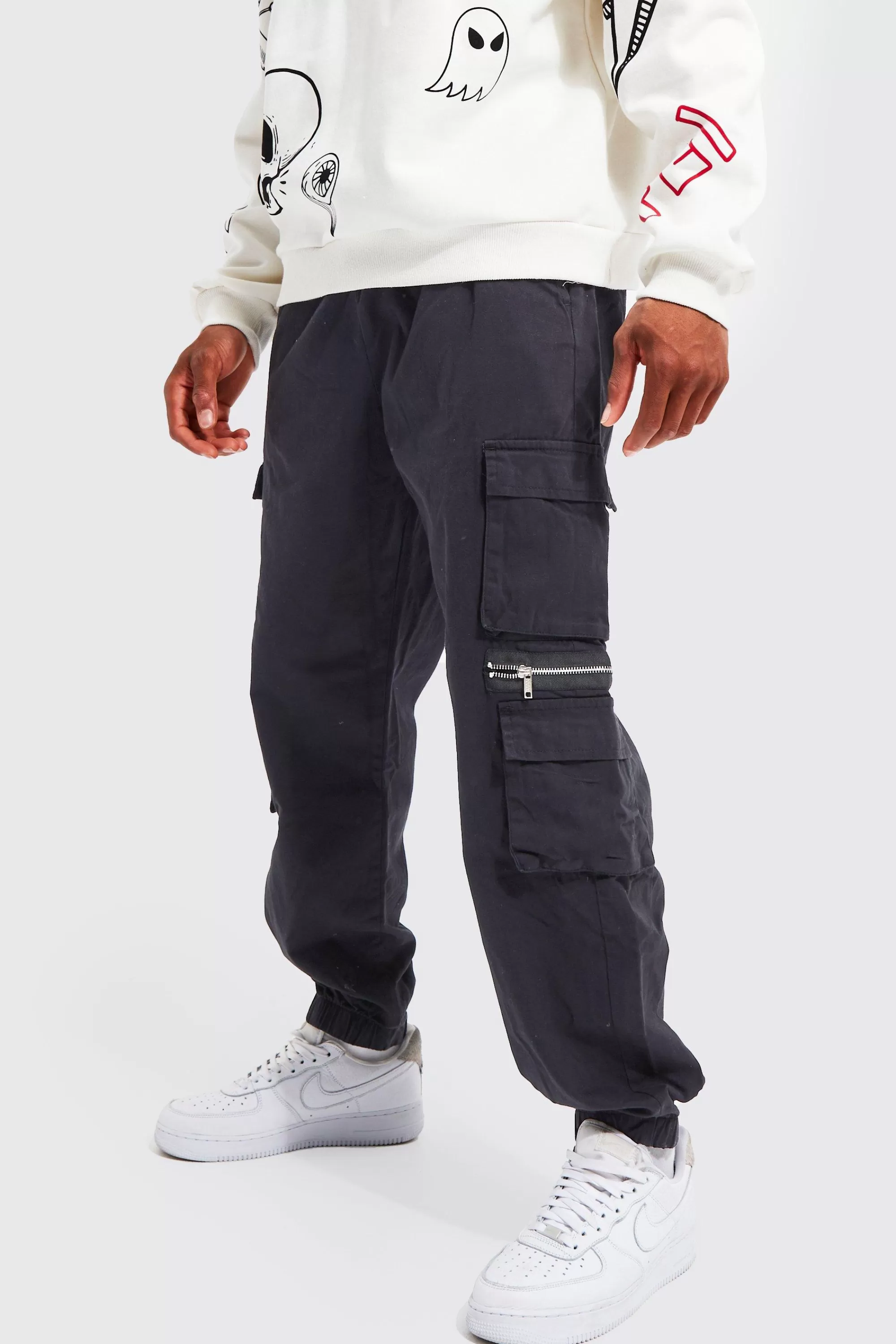 boohooMAN Elasticated Waist Multi Pocket Zip Cargo Trouser | UK