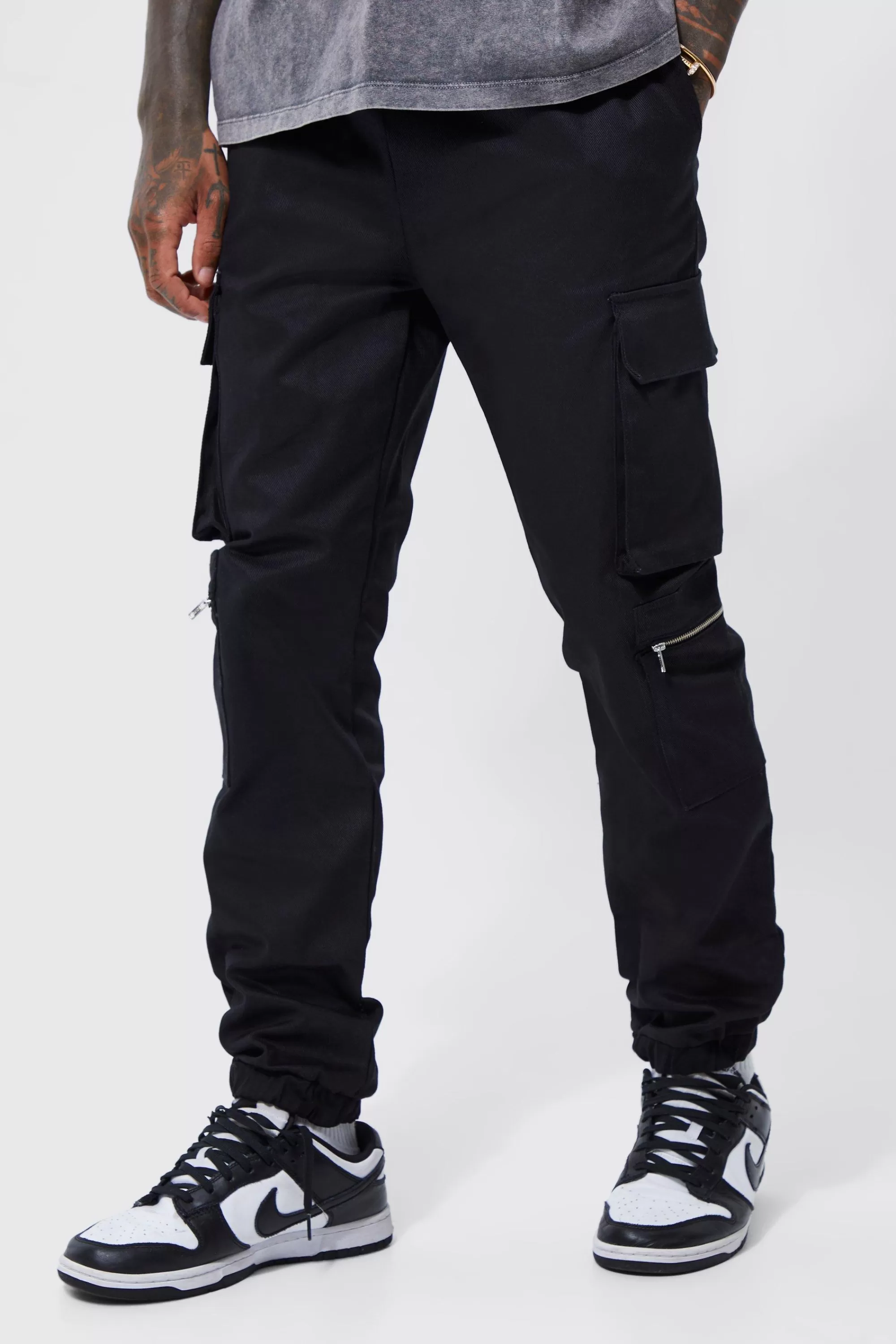 boohooMAN Elasticated Waist Multi Pocket Zip Cargo Trouser | UK