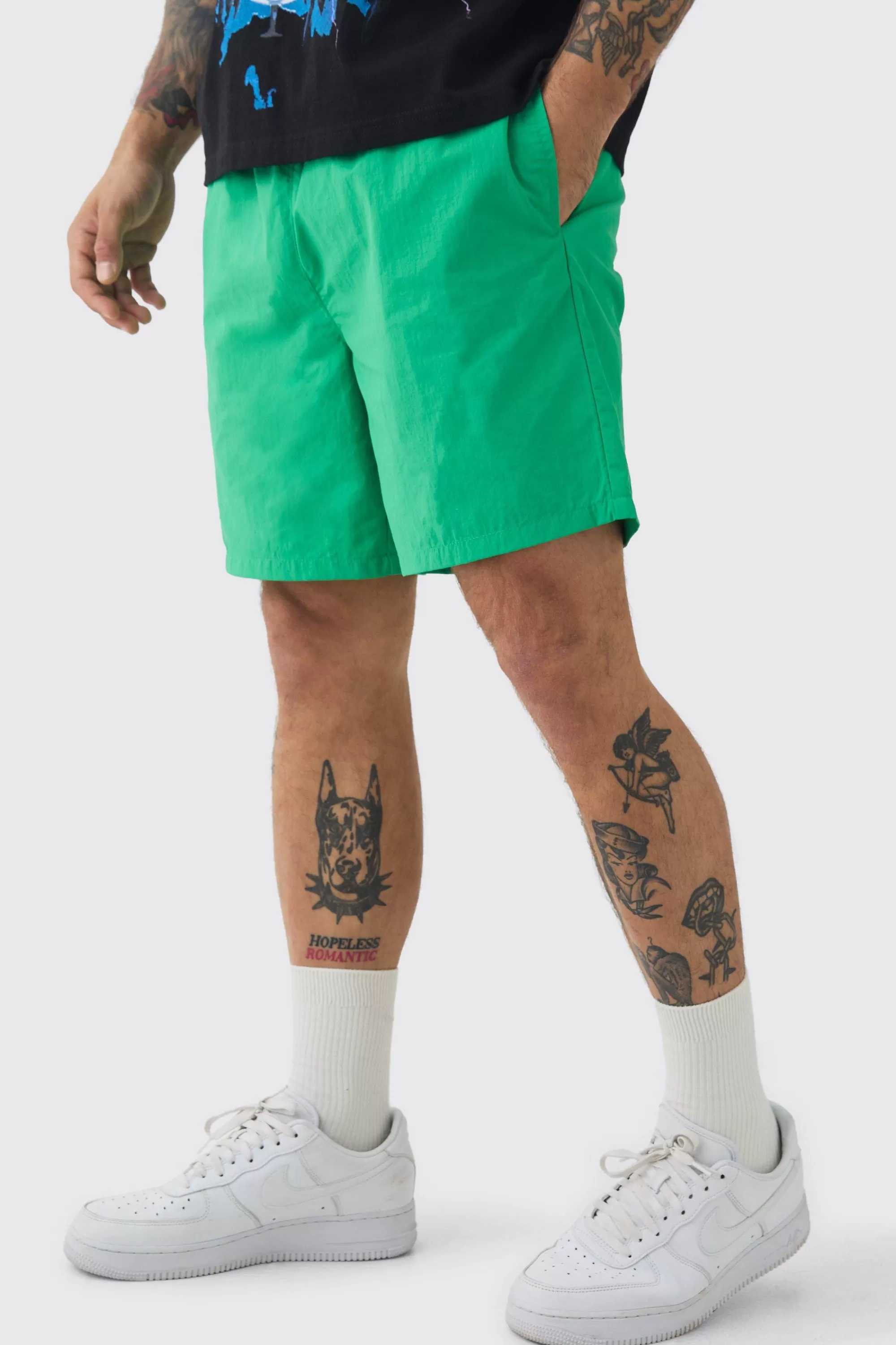 boohooMAN Elasticated Waist Relaxed Contrast Drawcord Shell Short Shorts | UK