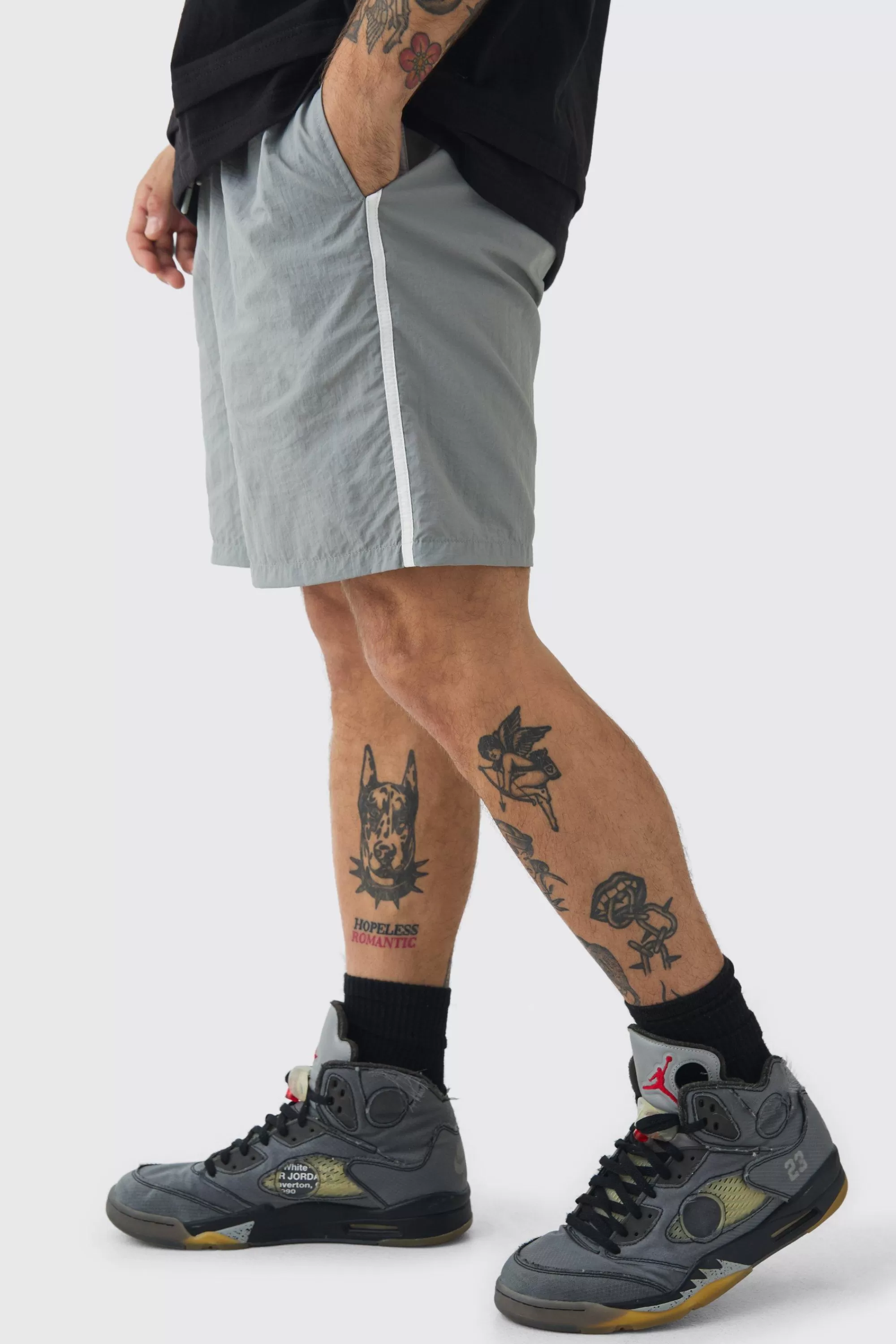 boohooMAN Elasticated Waist Relaxed Side Piping Shell Short Shorts In | UK