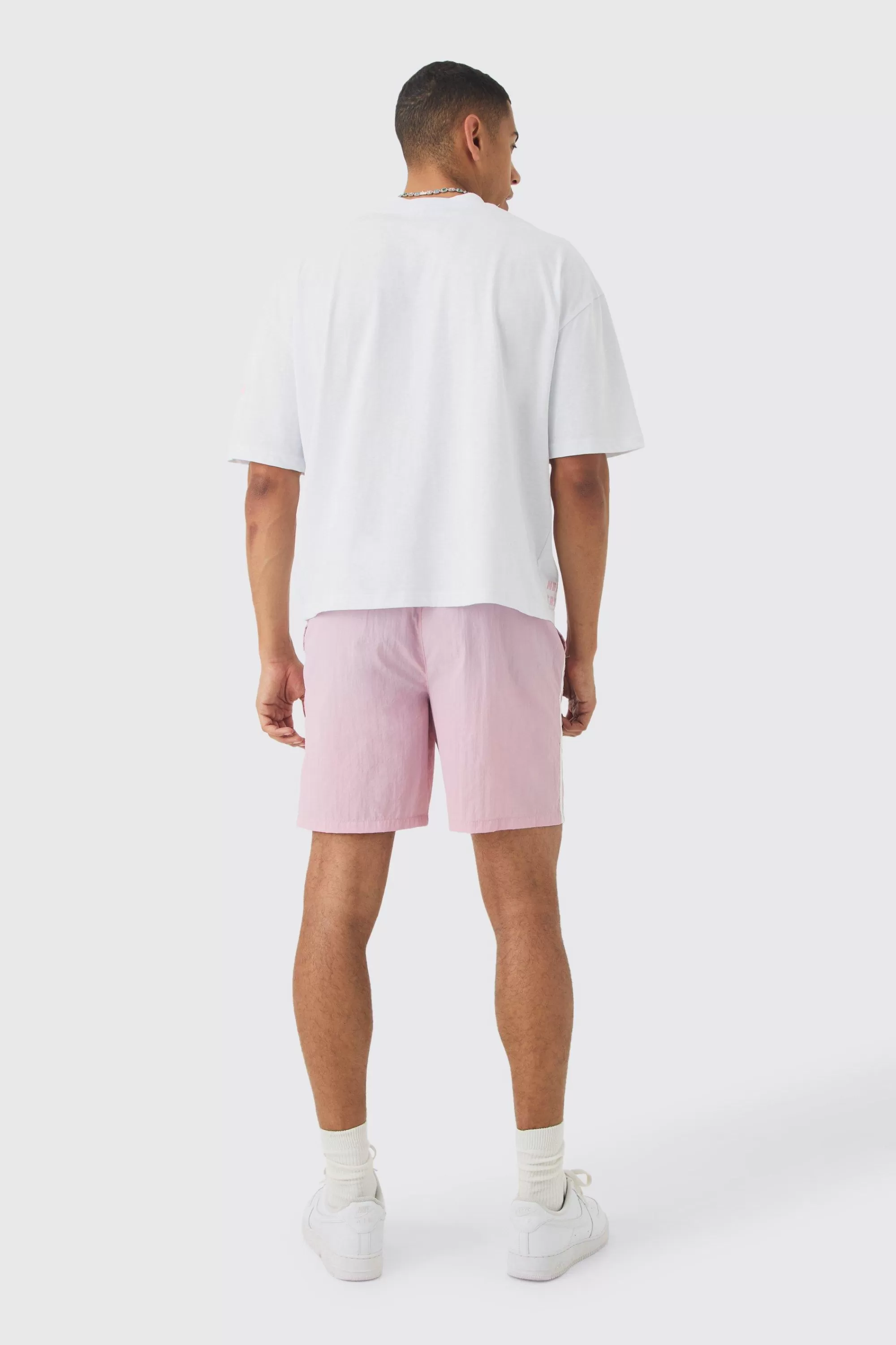 boohooMAN Elasticated Waist Relaxed Side Piping Shell Short Shorts In | UK