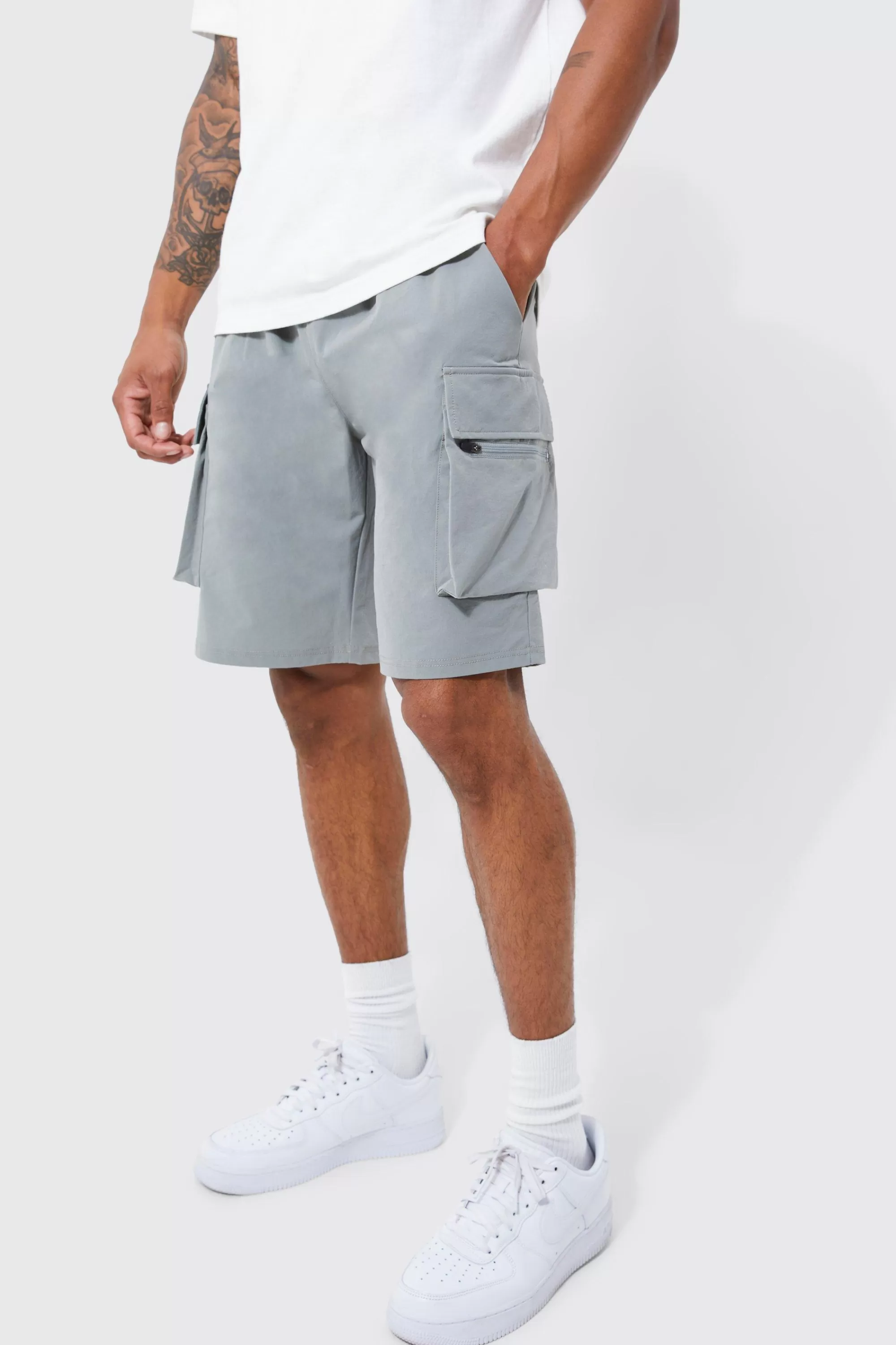 boohooMAN Elasticated Waist Relaxed Technical Stretch Cargo Short | UK