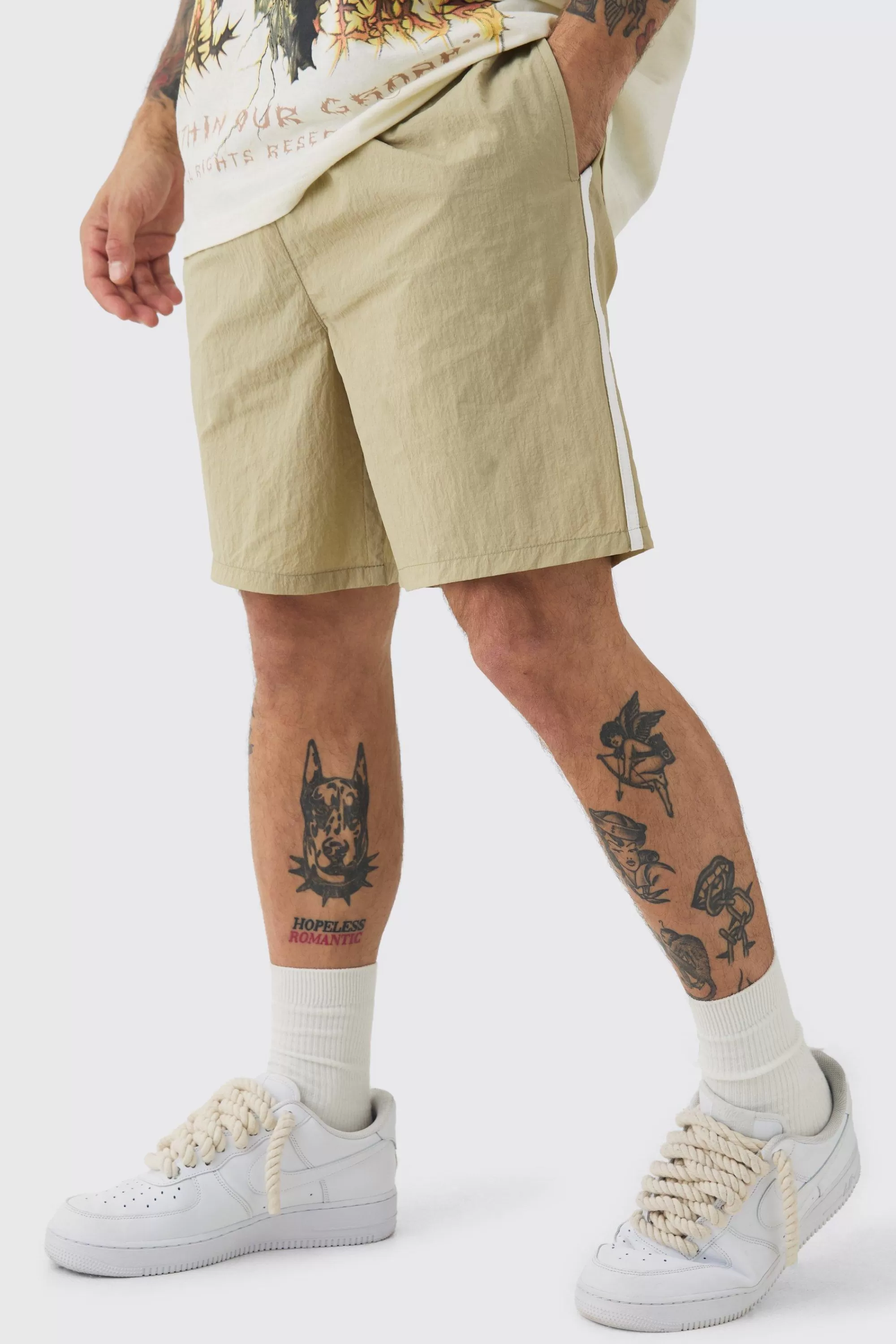boohooMAN Elasticated Waist Side Piping Shell Shorts In | UK