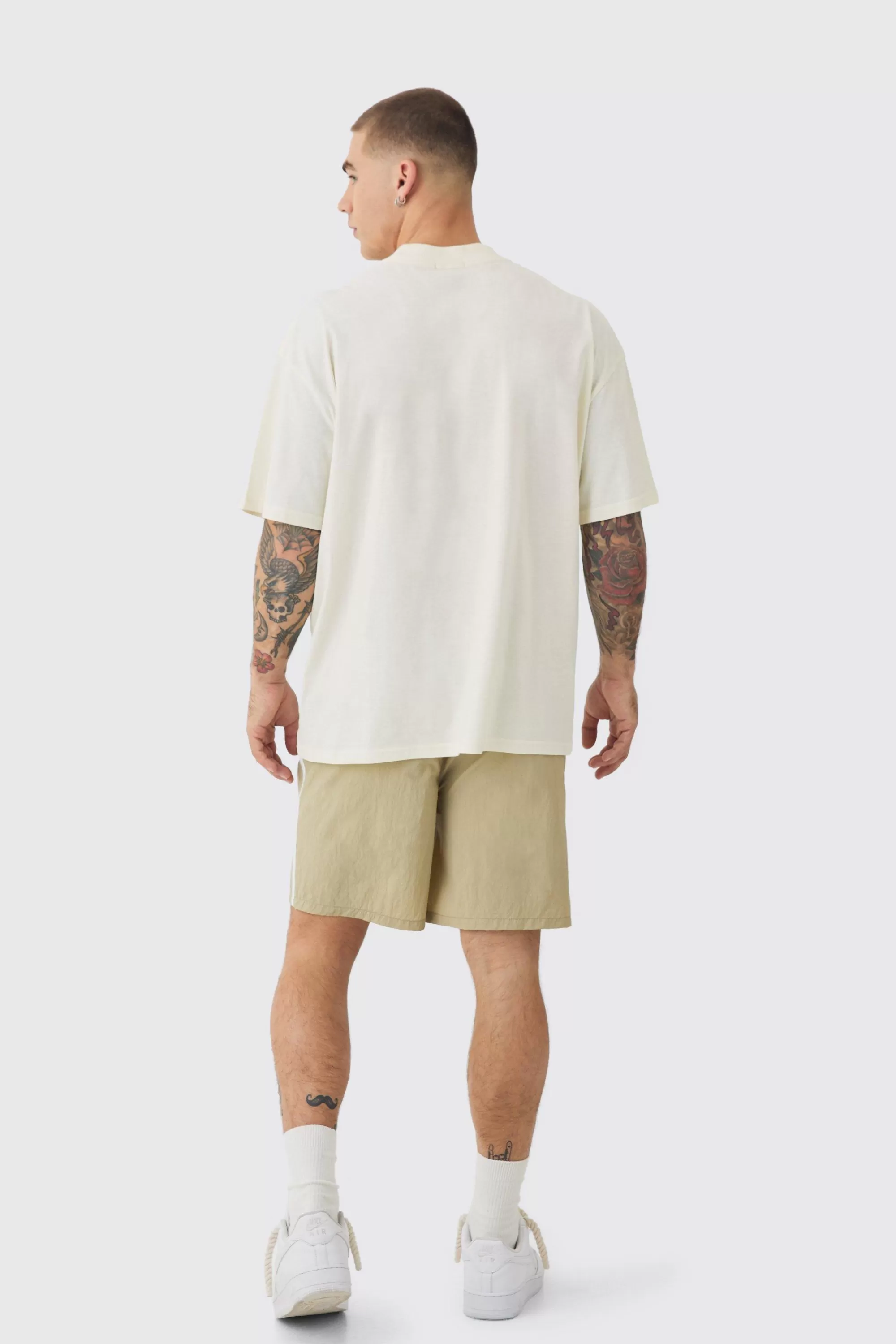 boohooMAN Elasticated Waist Side Piping Shell Shorts In | UK