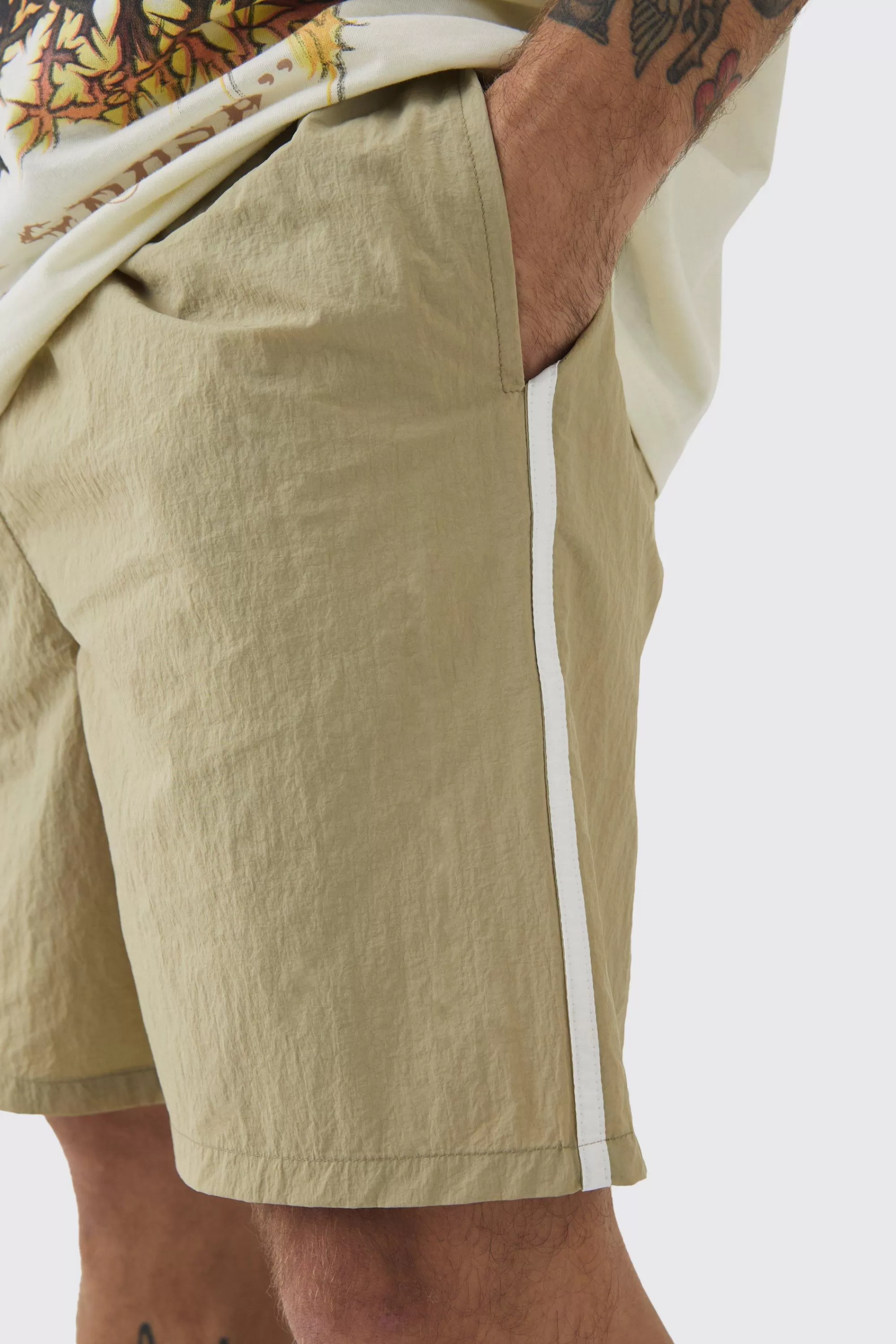 boohooMAN Elasticated Waist Side Piping Shell Shorts In | UK