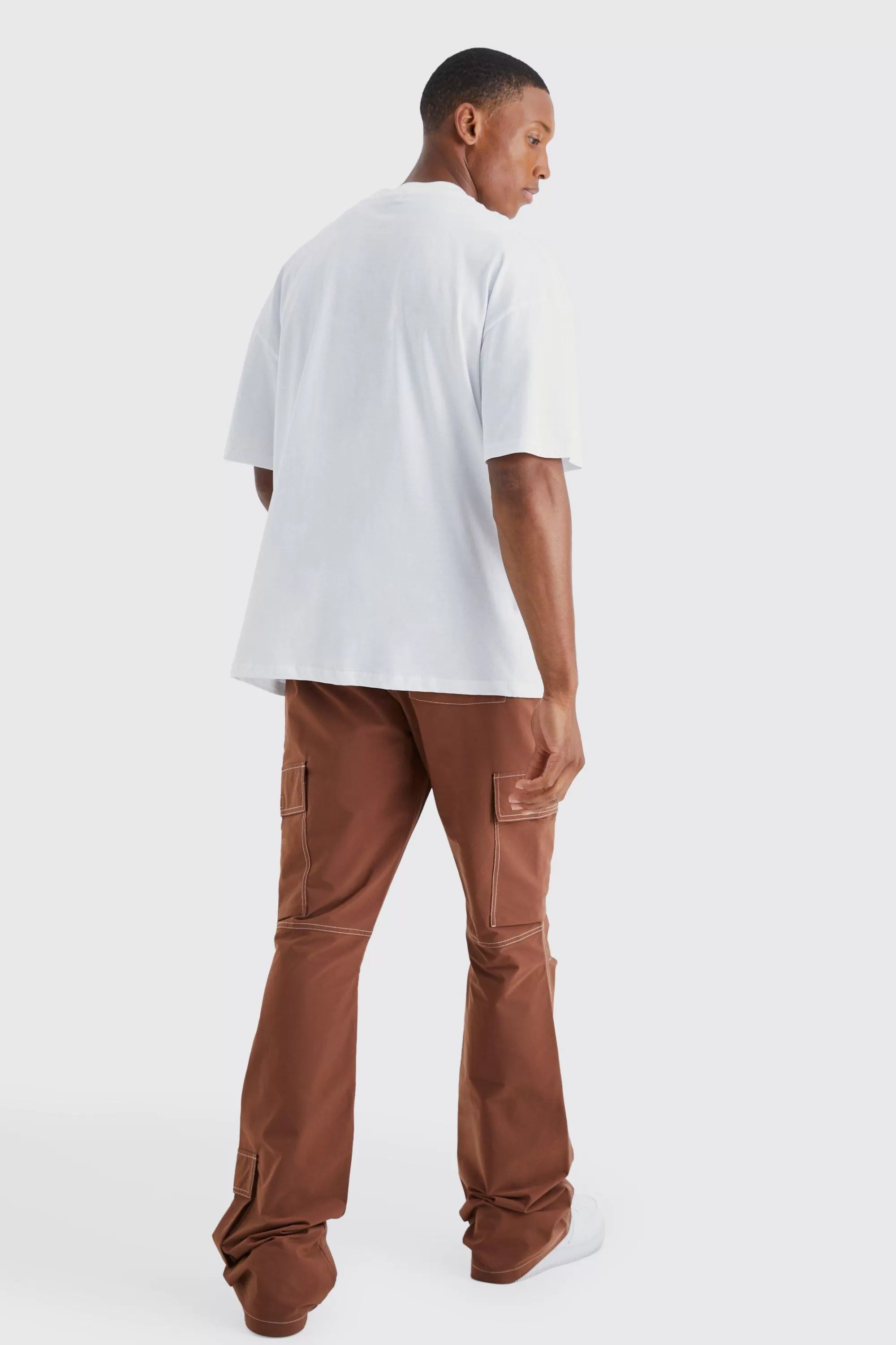 boohooMAN Elasticated Waist Slim Flare Contrast Stitch Cargo Trouser | UK