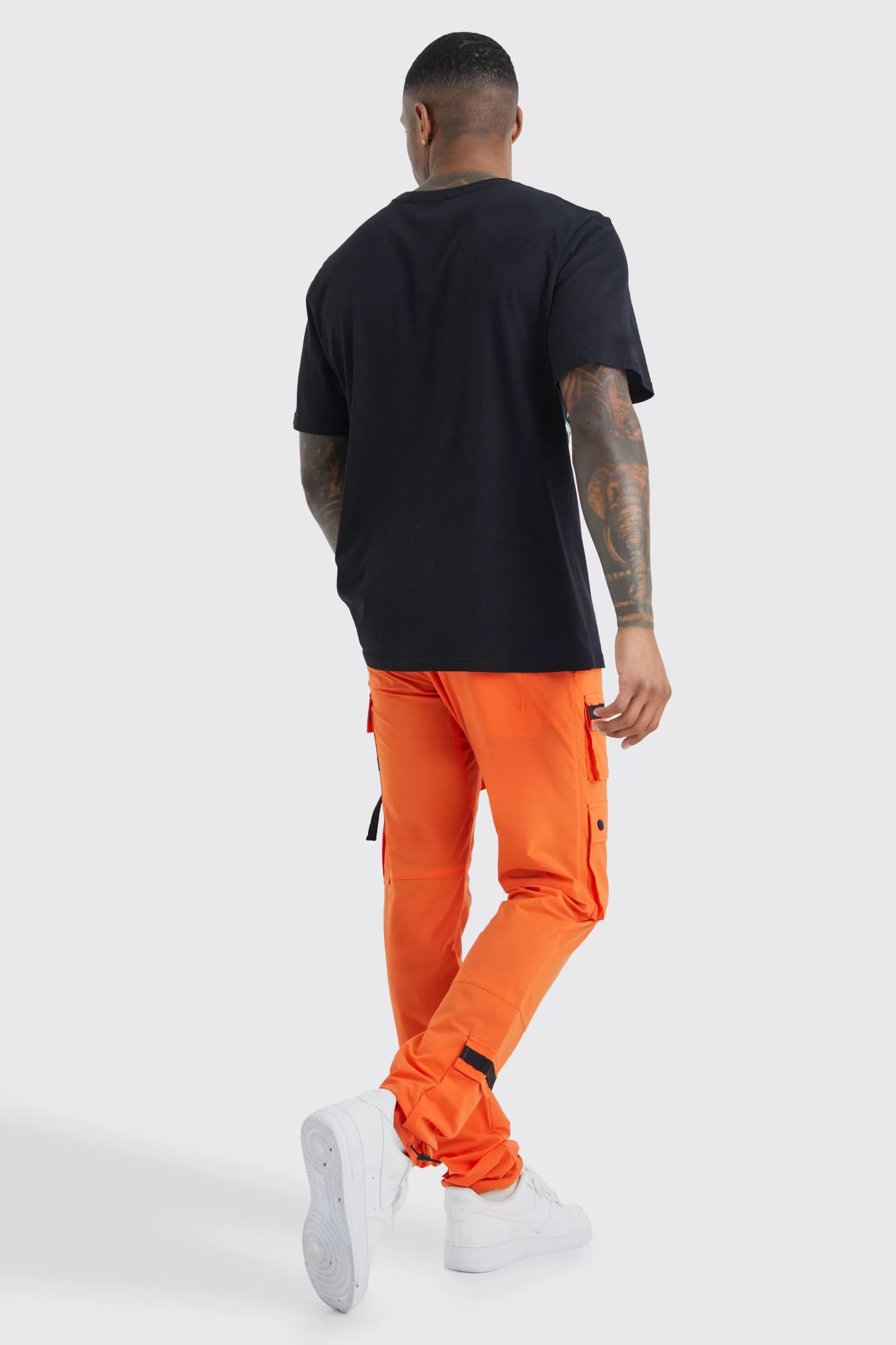 boohooMAN Elasticated Waist Slim Multi Cargo Strap Trouser | UK