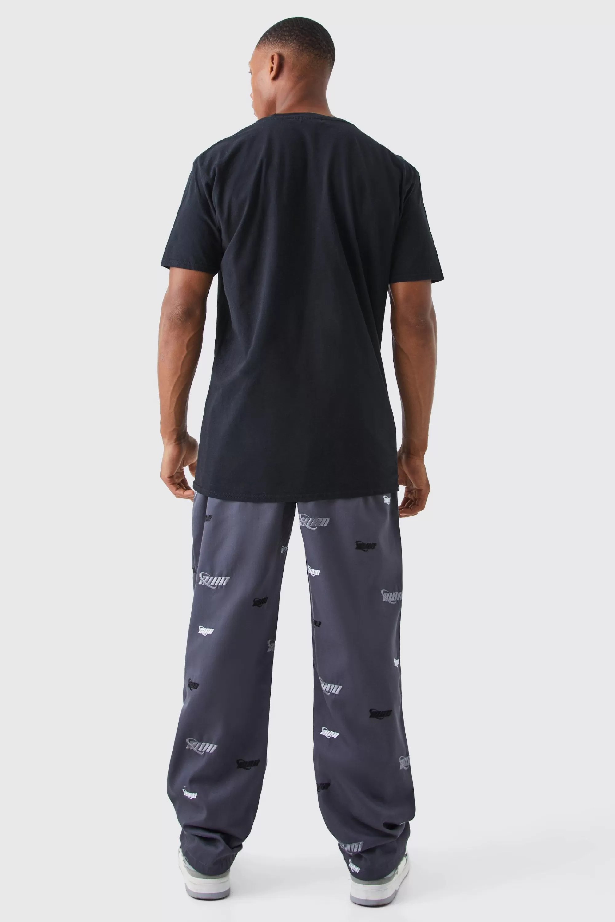 boohooMAN Fixed Waist Relaxed All Over Embroidery Trouser | UK
