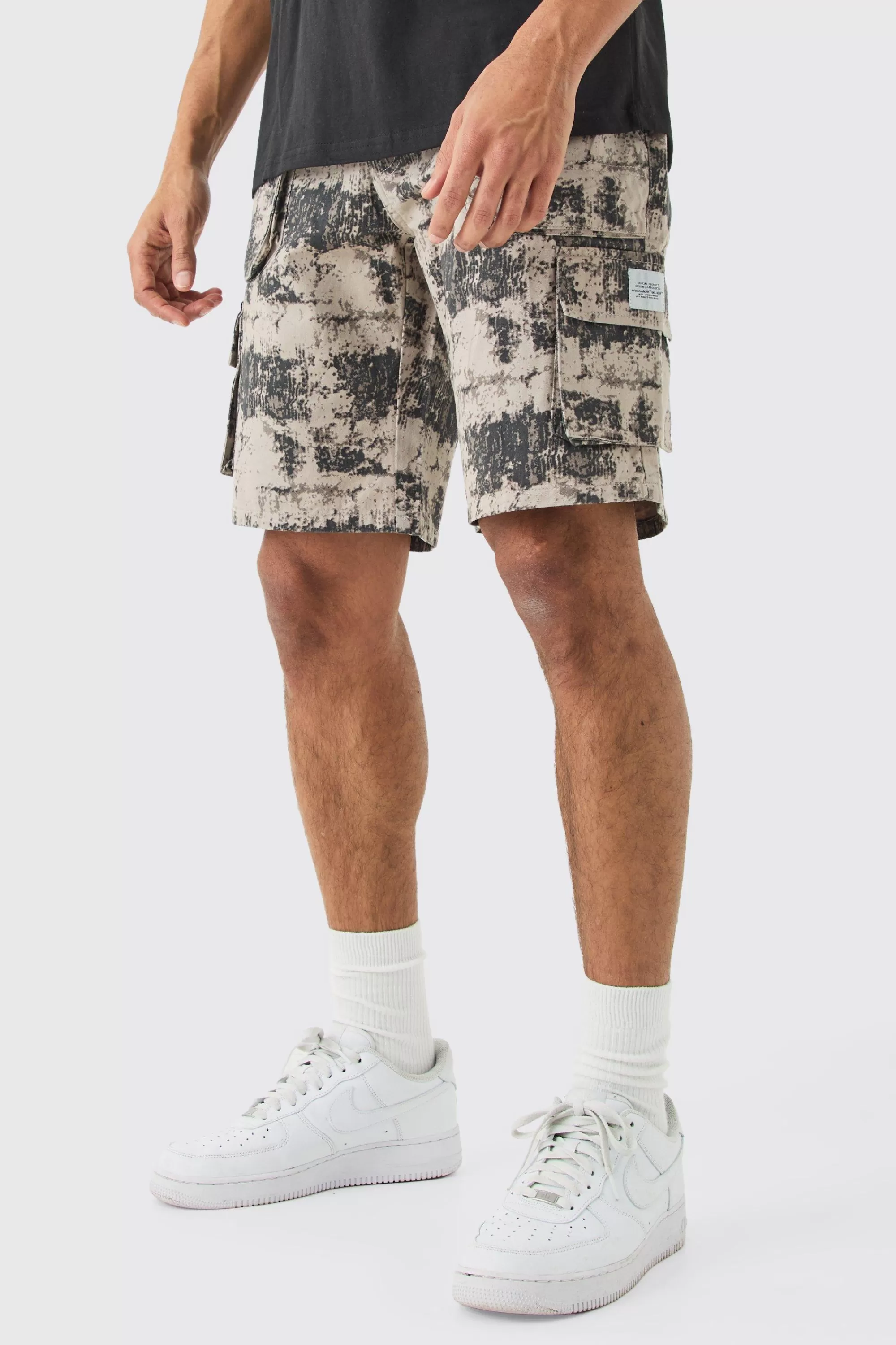 boohooMAN Fixed Waist Woven Tab Blurred Camo Relaxed Cargo Shorts | UK