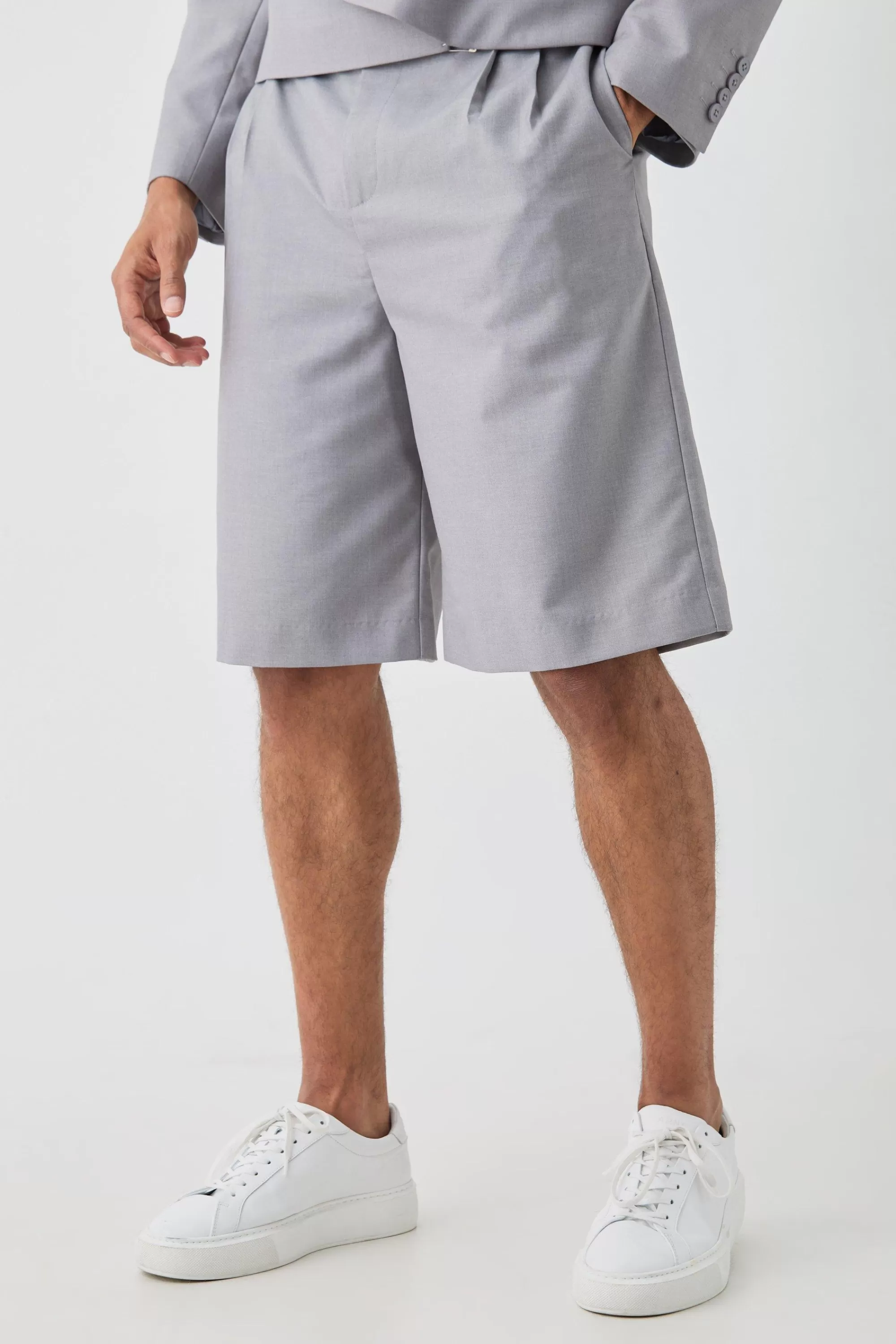 boohooMAN Fixed Waistband Tailored Pleated Jorts In | UK