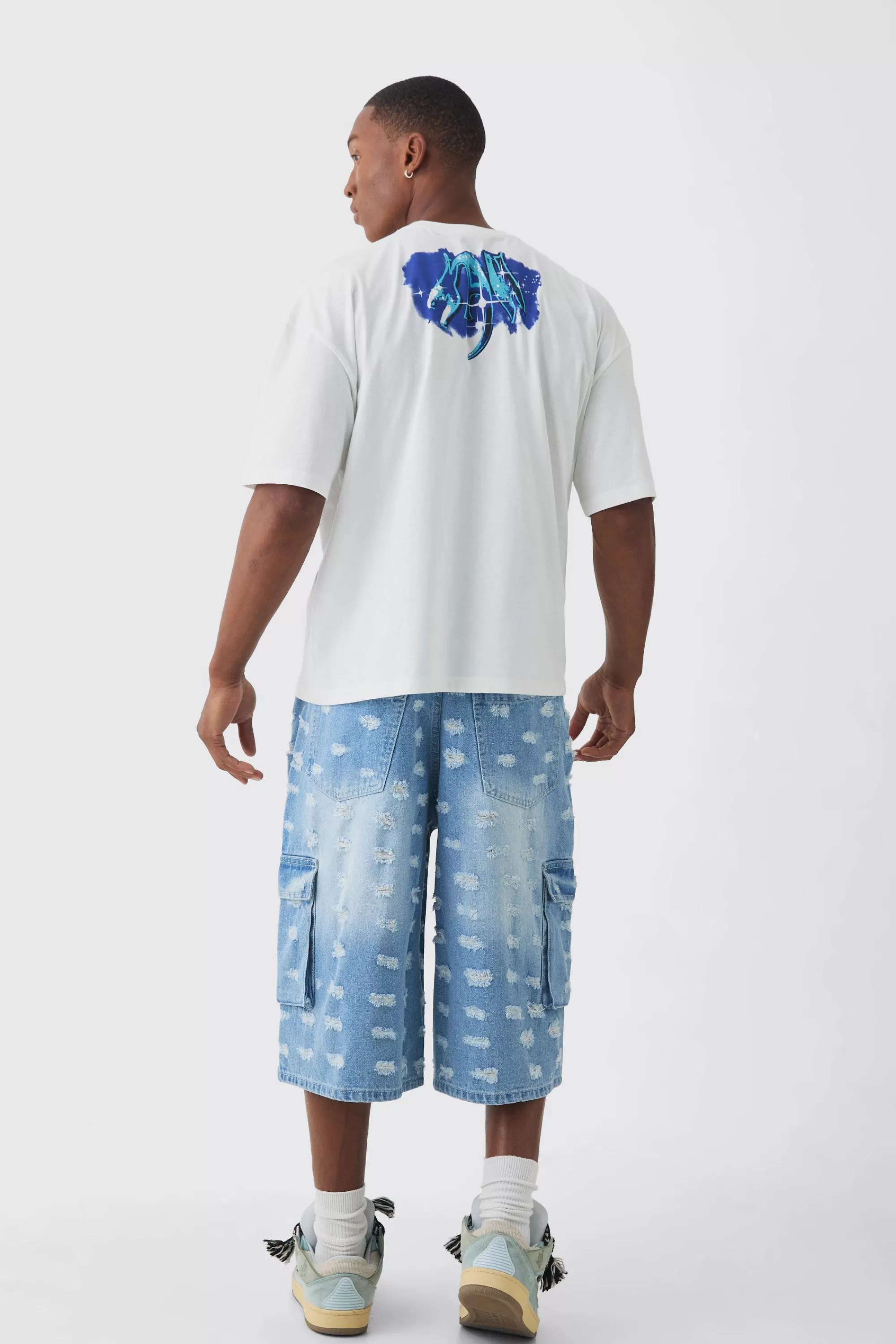 boohooMAN Longline All Over Distressed Cargo Denim Jorts In | UK