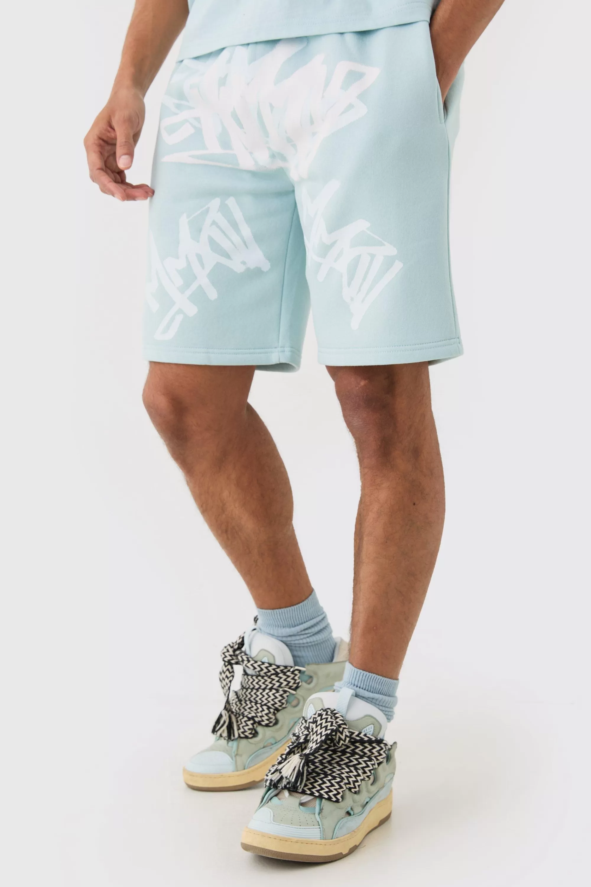boohooMAN Loose Fit Graffiti Printed Jersey Shorts | UK