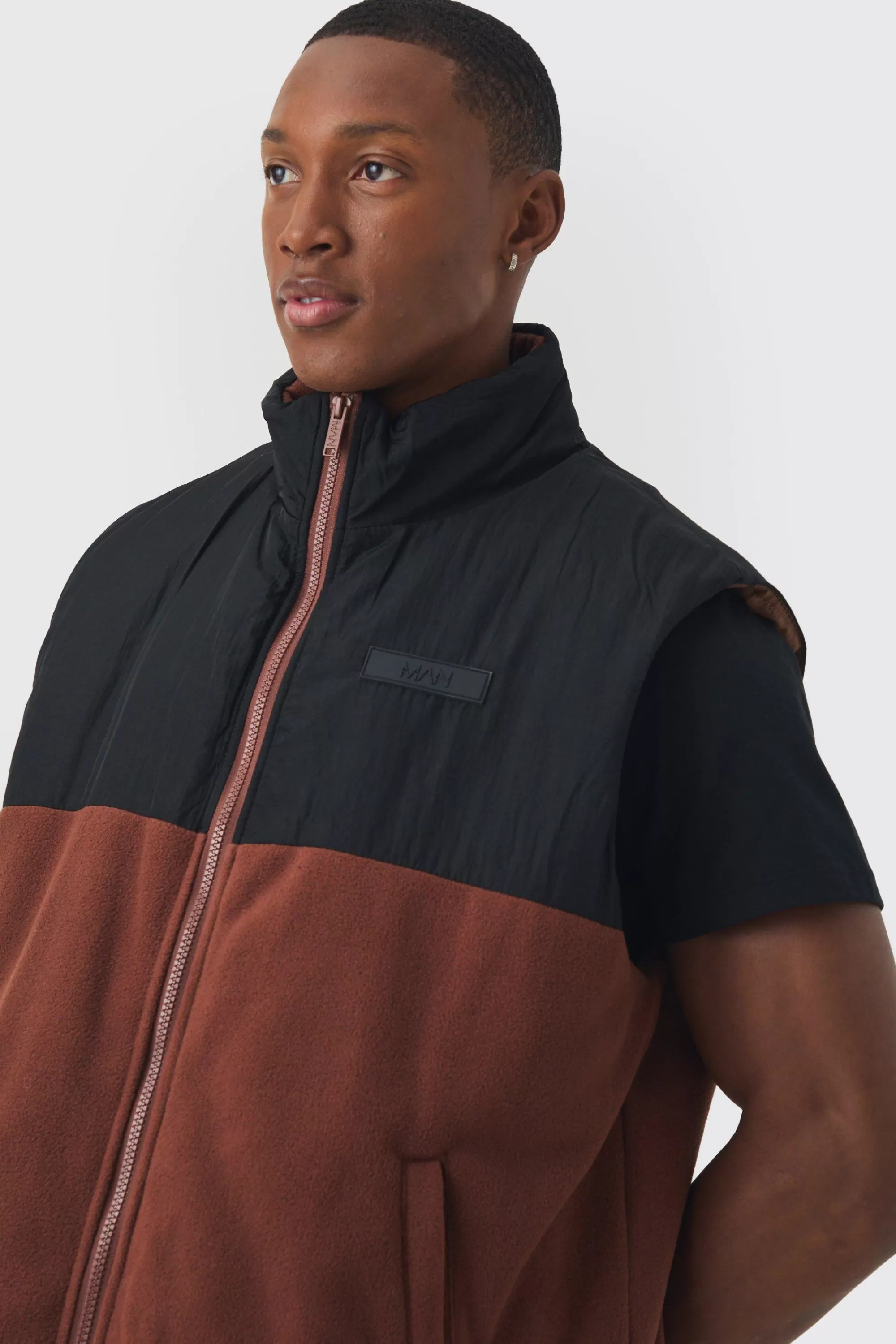 boohooMAN Man Tab Boxy Colour Block Fleece Gilet In | UK