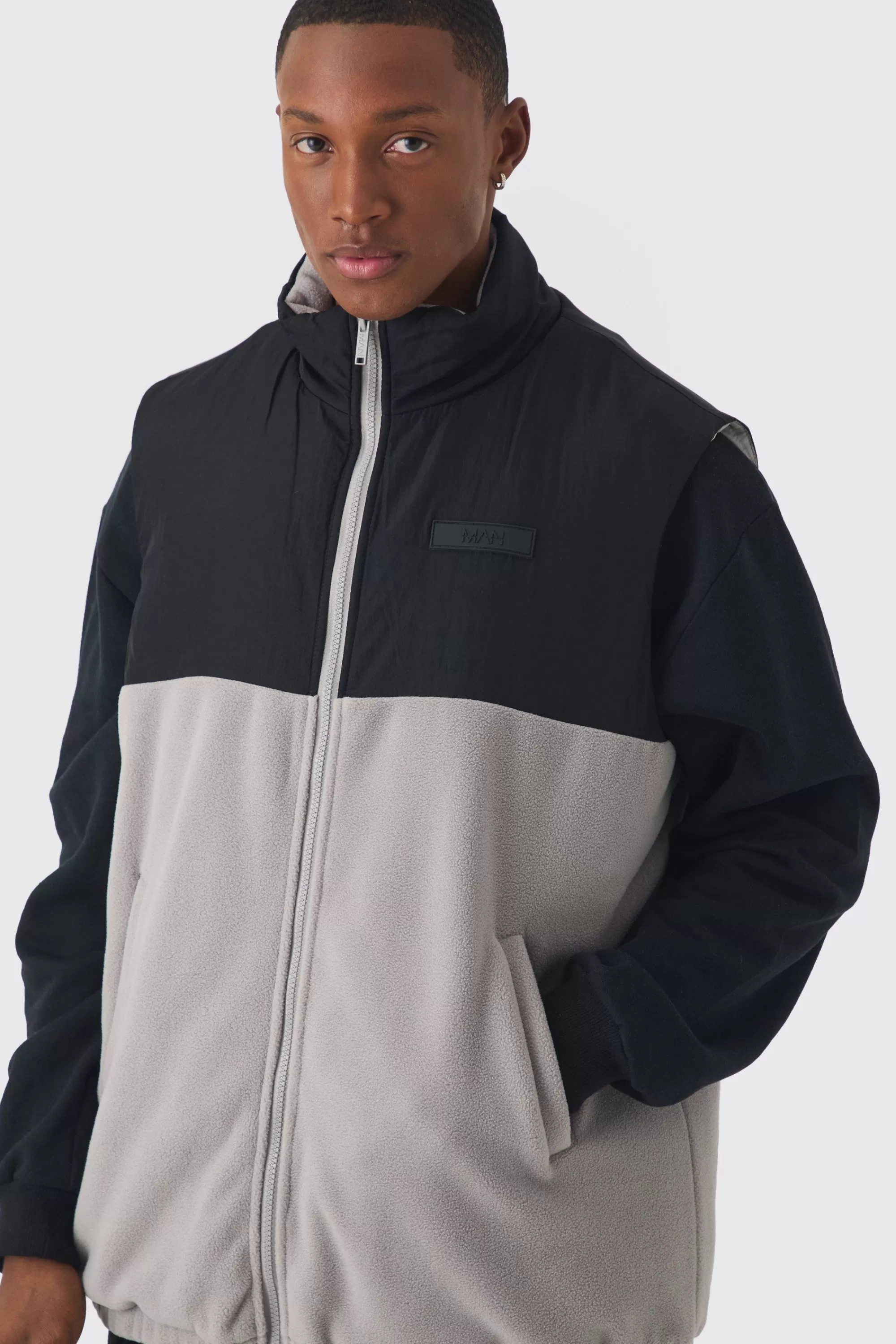 boohooMAN Man Tab Boxy Colour Block Fleece Gilet In | UK