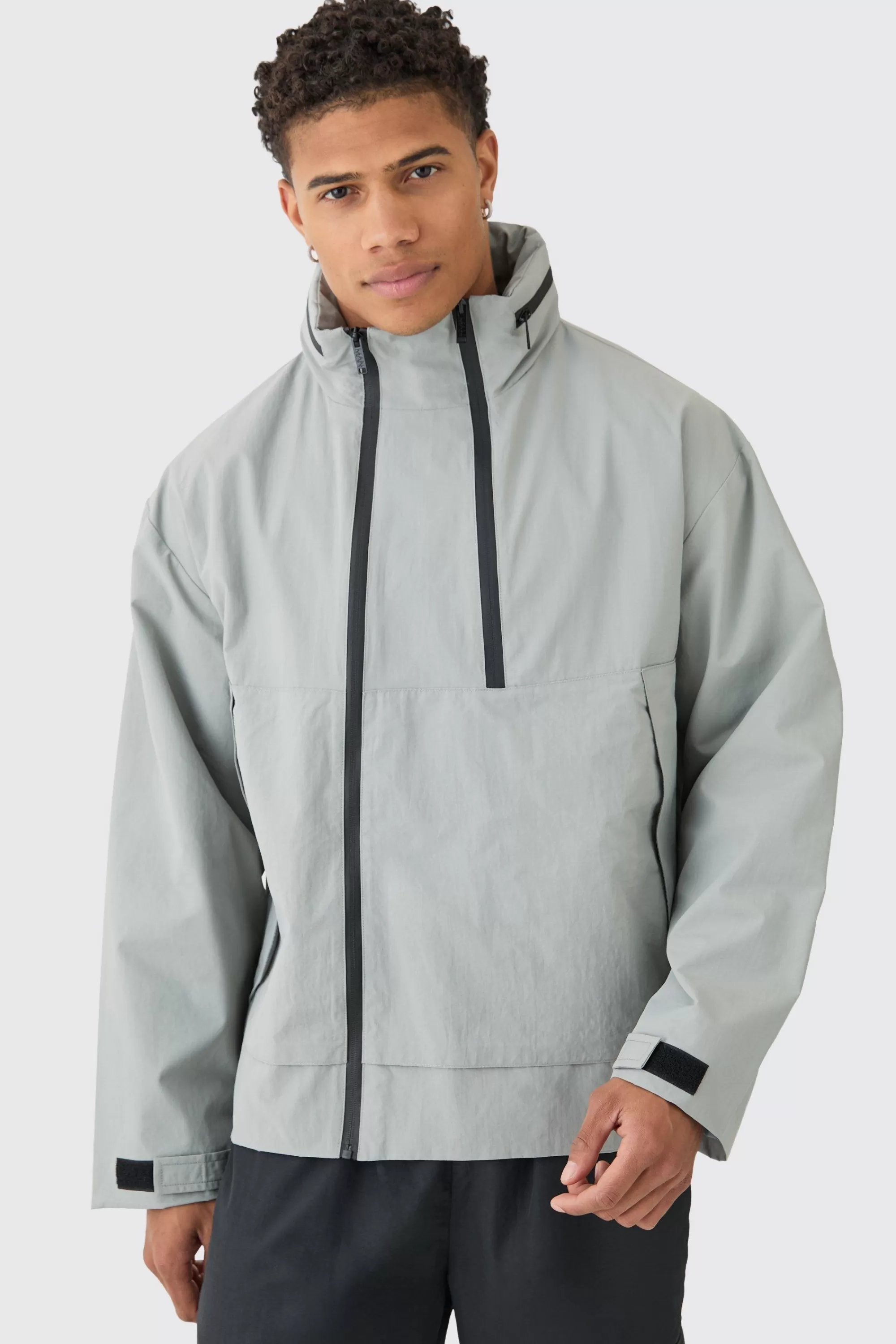 boohooMAN Man Tab Oversized Zip Detail Nylon Windbreaker In | UK