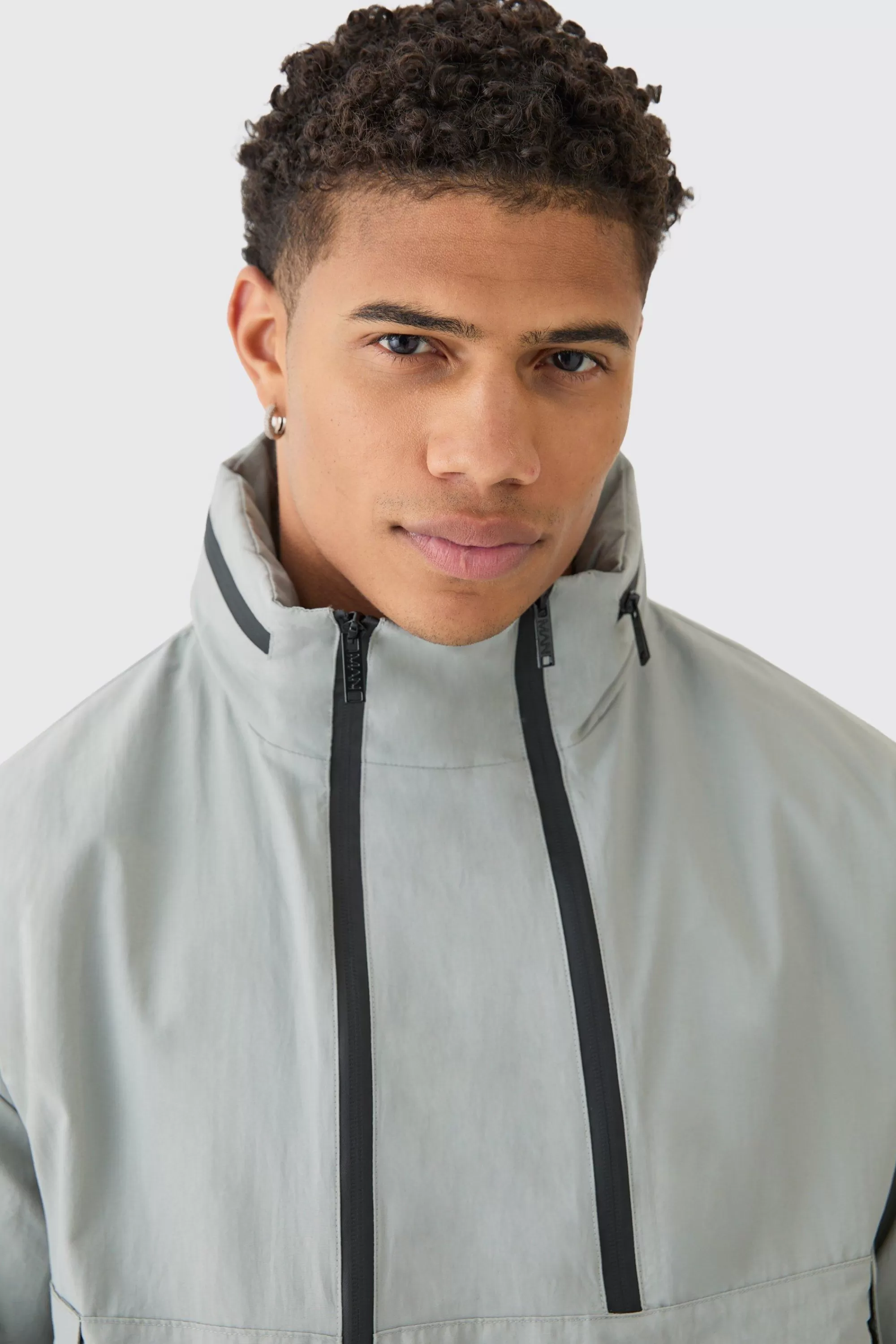 boohooMAN Man Tab Oversized Zip Detail Nylon Windbreaker In | UK