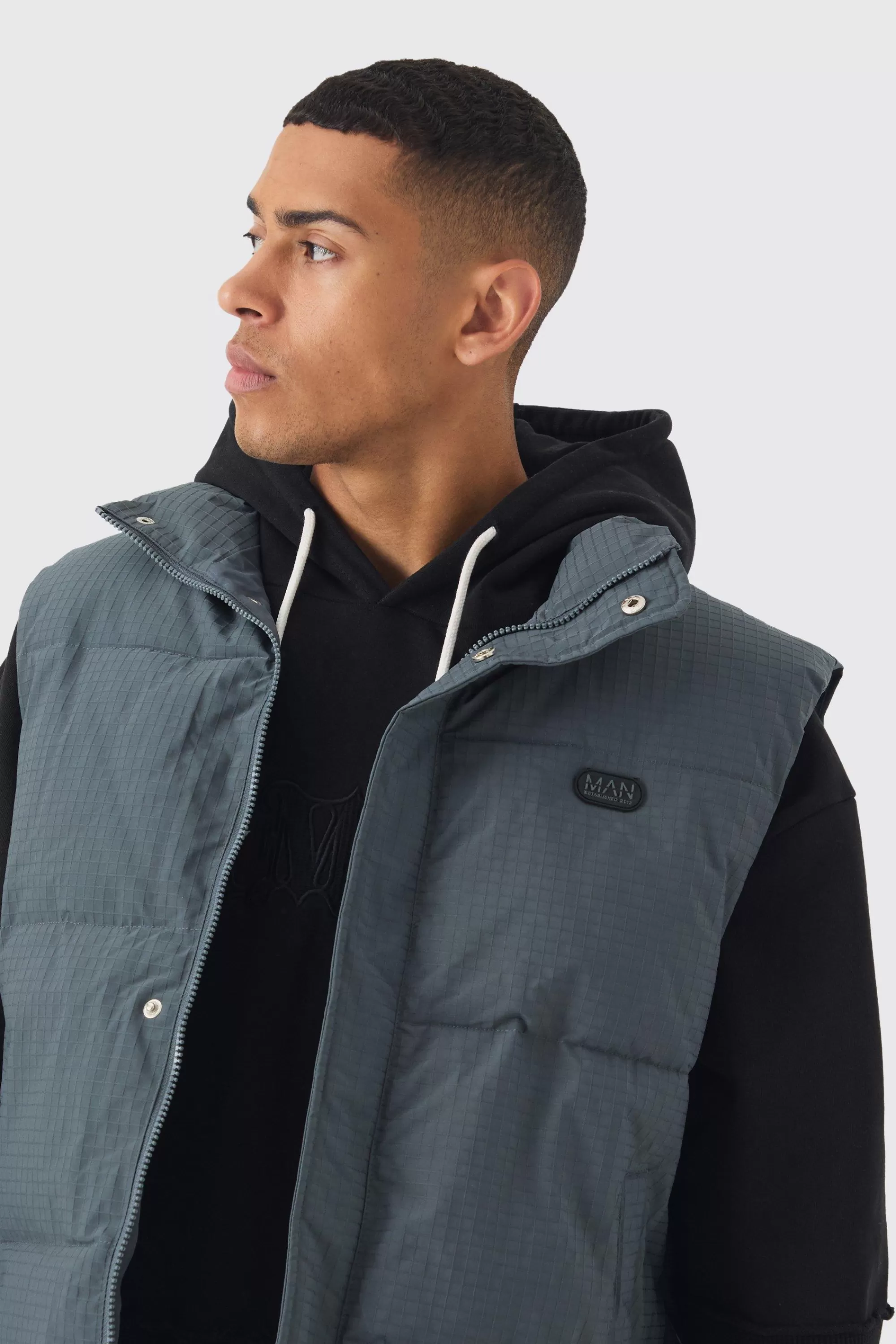 boohooMAN Man Tab Ripstop Funnel Neck Puffer Gilet In | UK