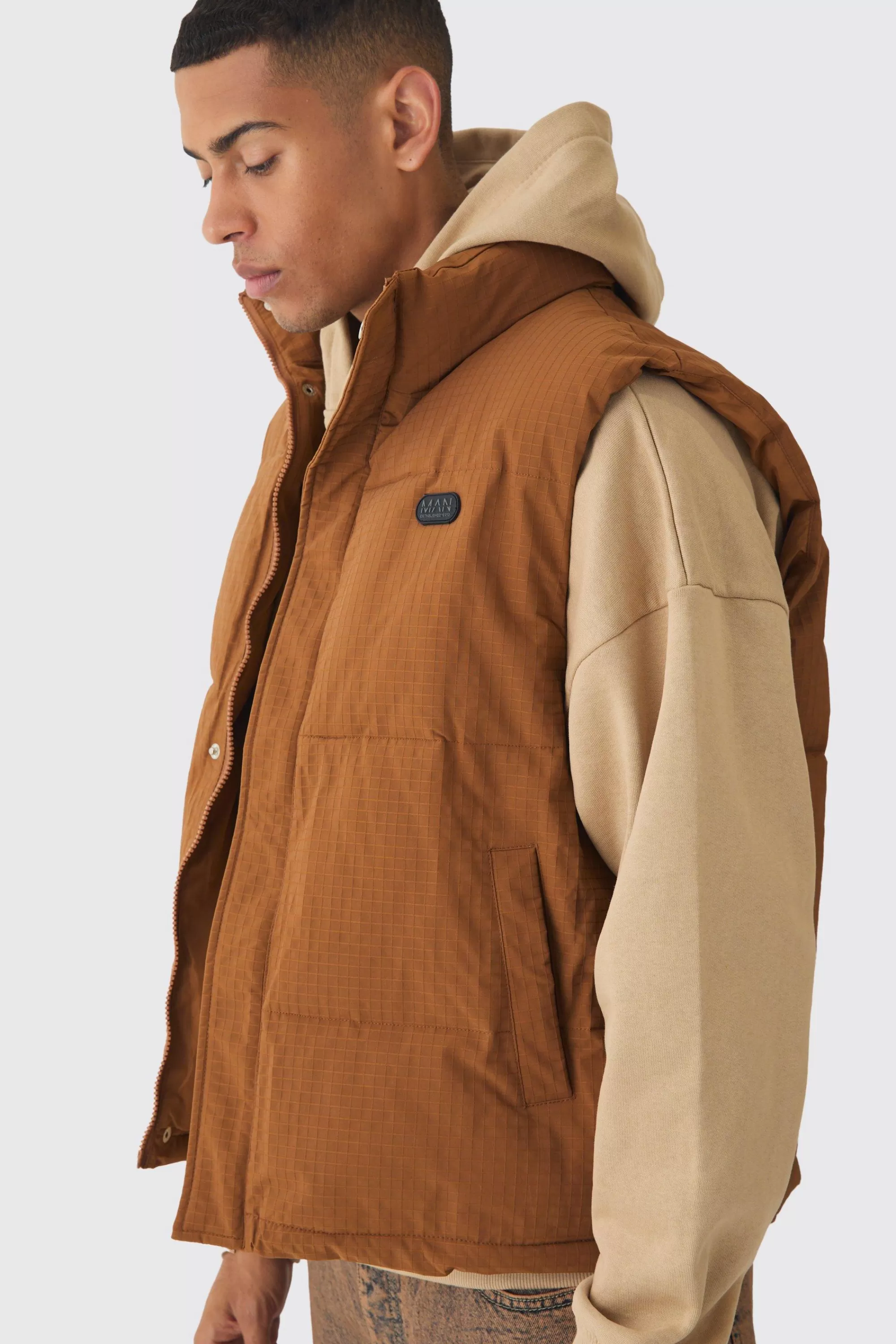 boohooMAN Man Tab Ripstop Funnel Neck Puffer Gilet In | UK