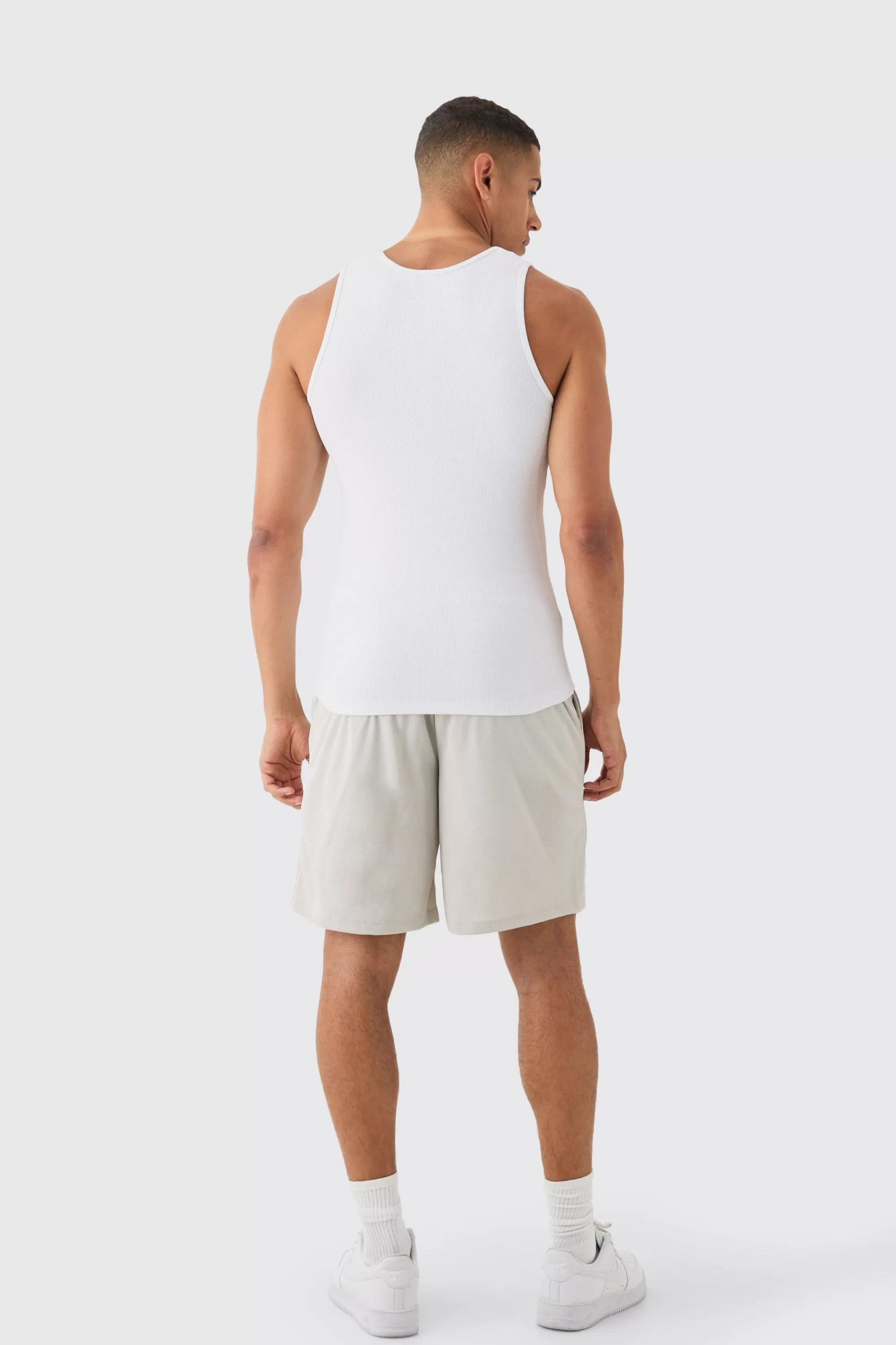 boohooMAN Muscle Fit Ribbed Vest & Mesh Basketball Shorts Set | UK