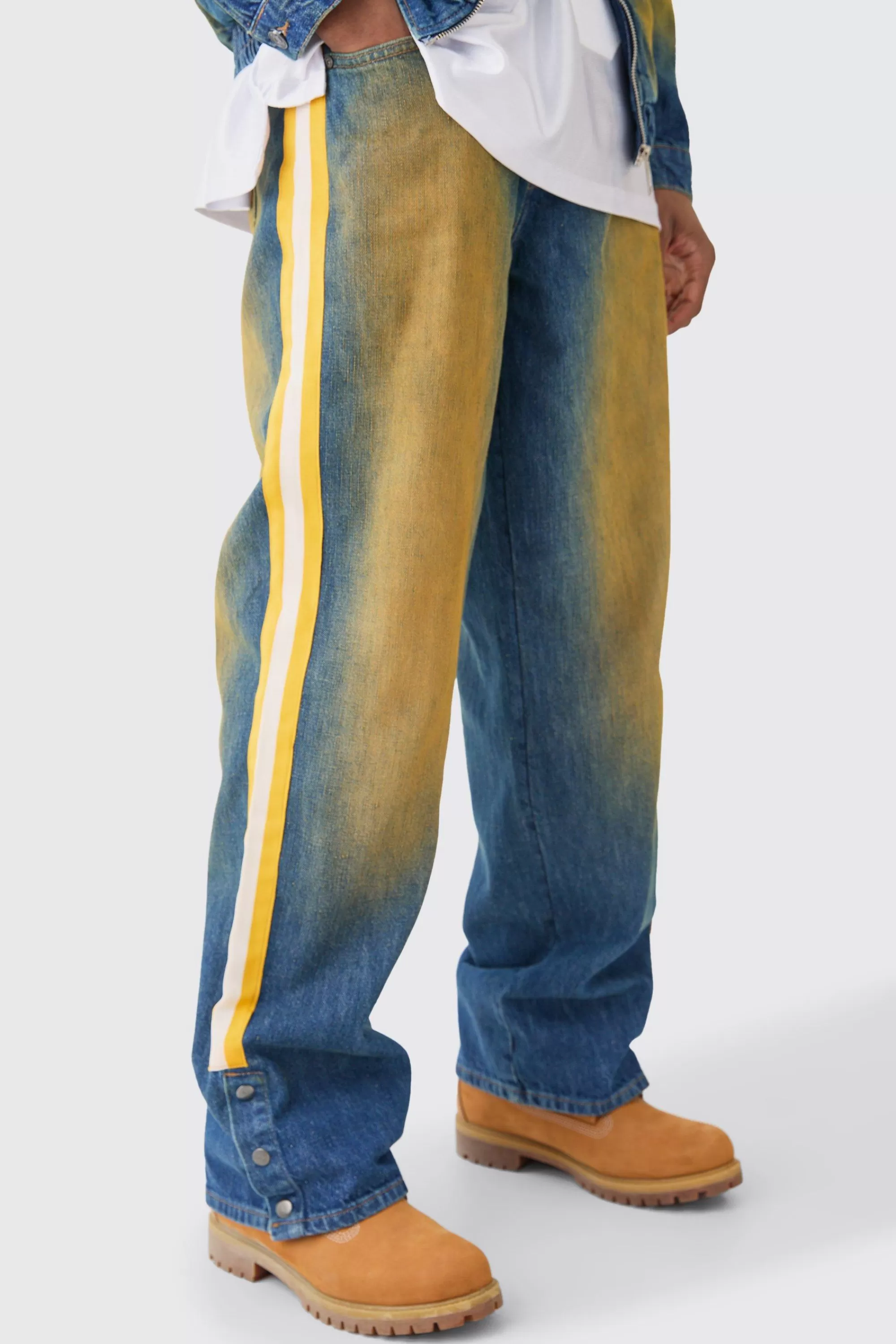 boohooMAN Nfl Chiefs Baggy Rigid Popper Hem Tape Detail Tinted Jeans | UK