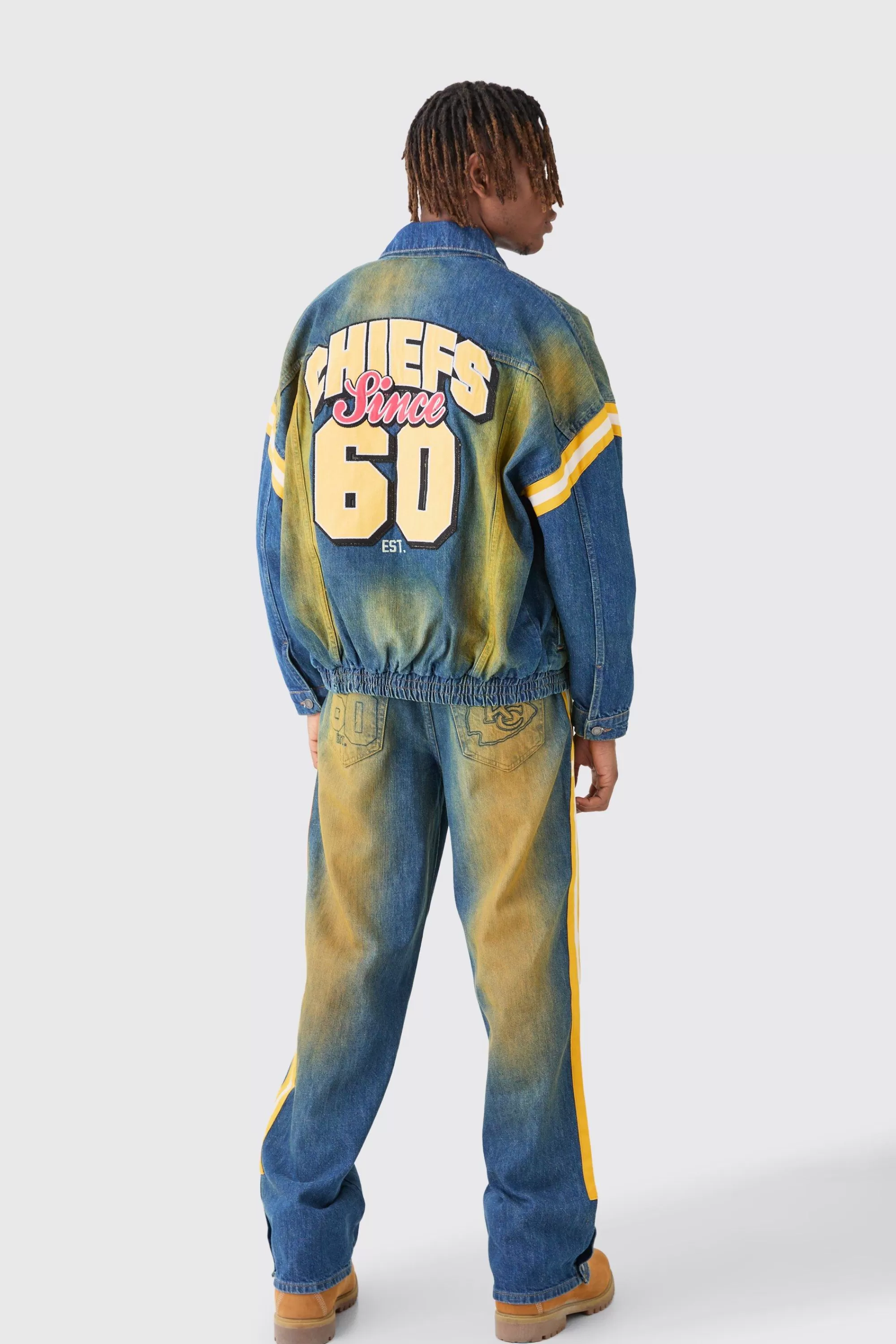 boohooMAN Nfl Chiefs Baggy Rigid Popper Hem Tape Detail Tinted Jeans | UK