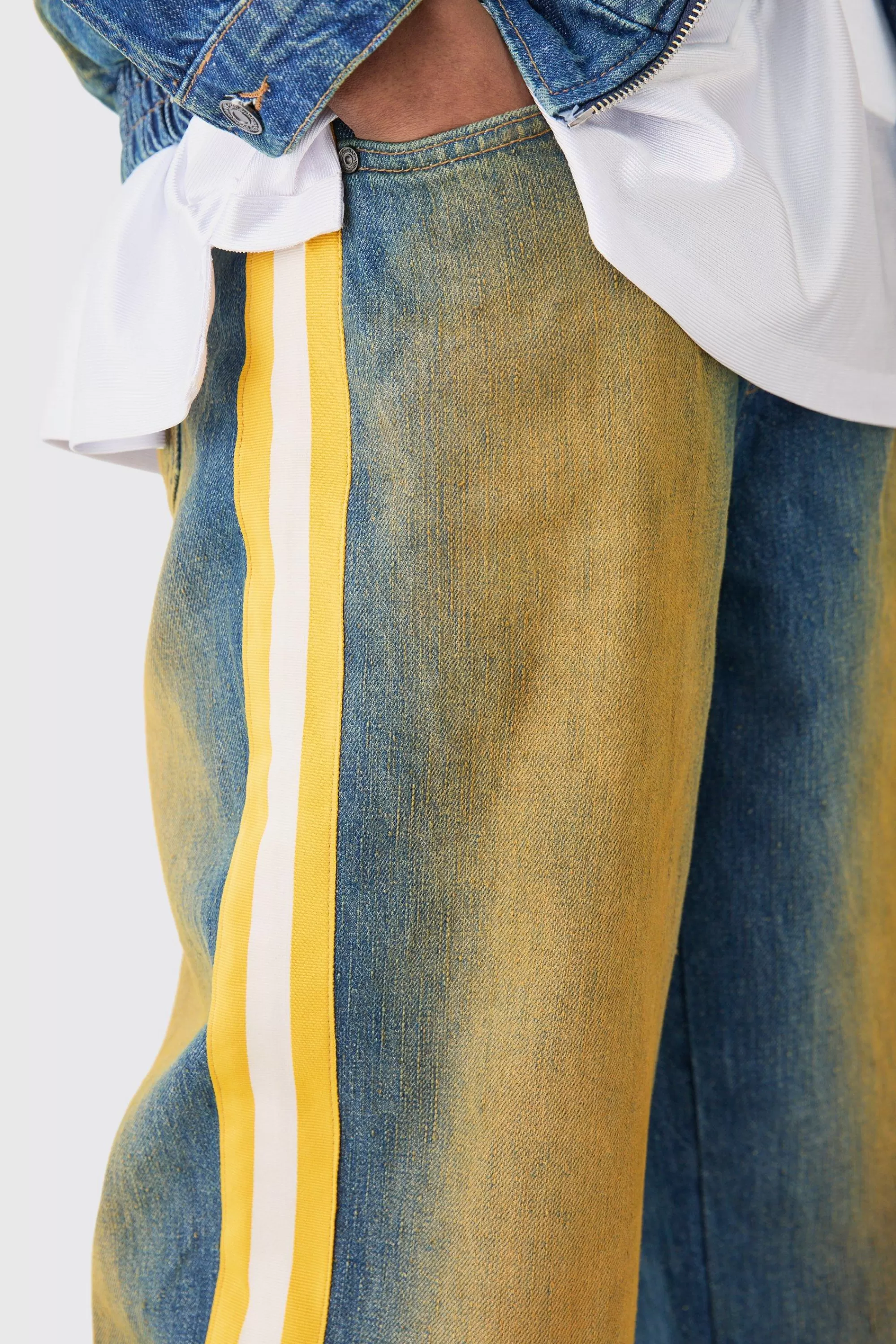 boohooMAN Nfl Chiefs Baggy Rigid Popper Hem Tape Detail Tinted Jeans | UK