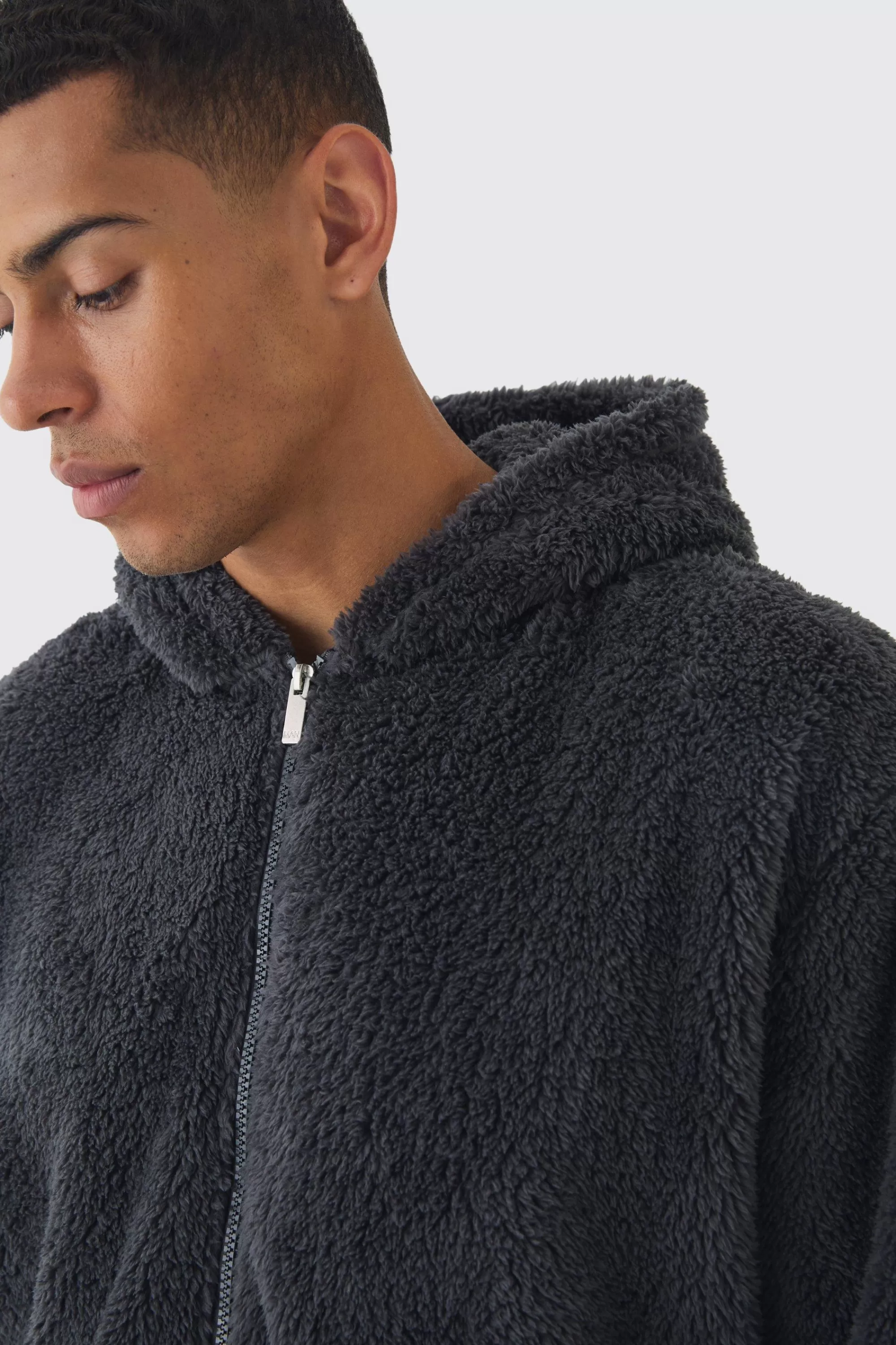 boohooMAN Oversized Boxy Cargo Pocket Zip Through Teddy Borg Hoodie | UK