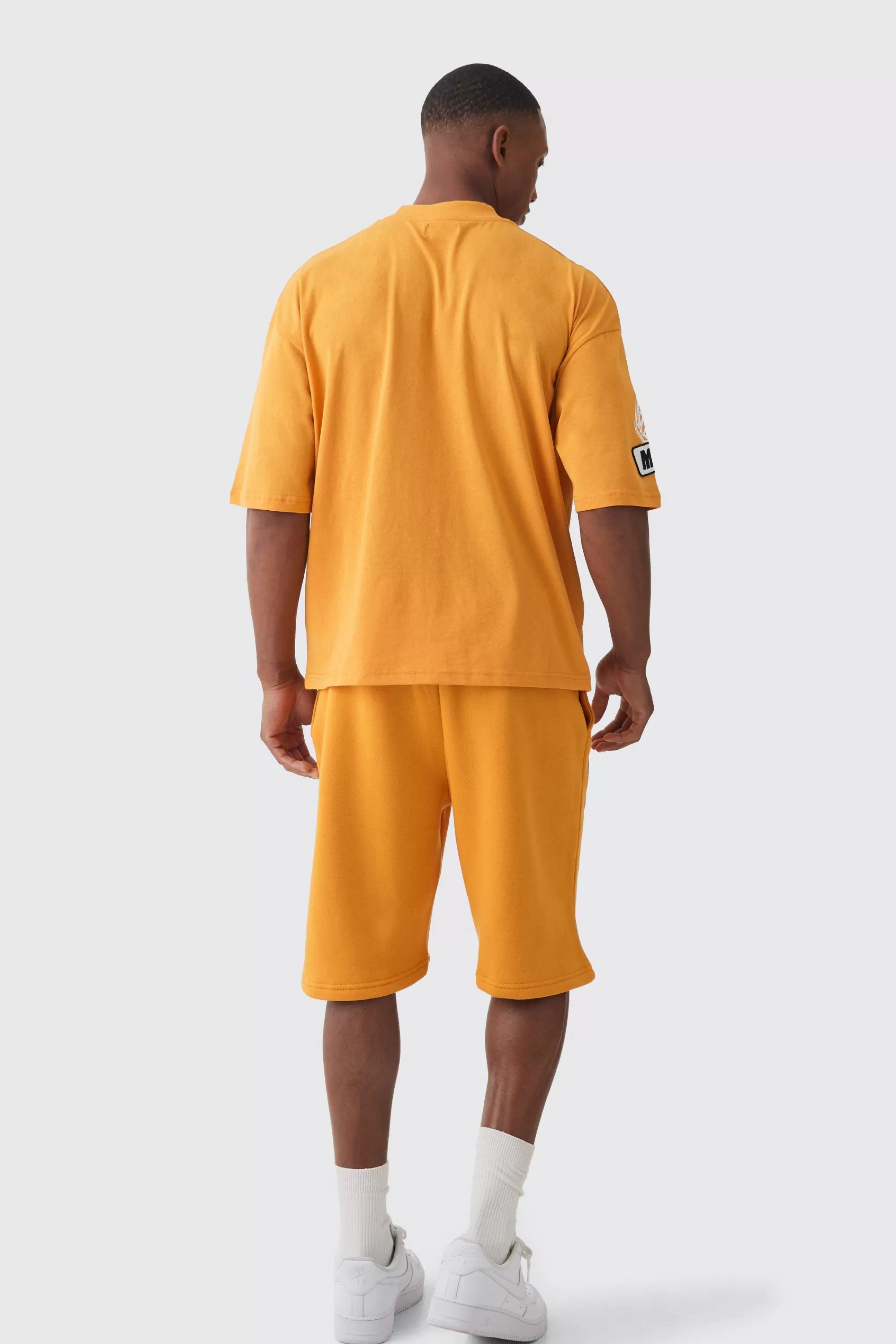boohooMAN Oversized Boxy Extended Neck Applique T-shirt & Short Set | UK