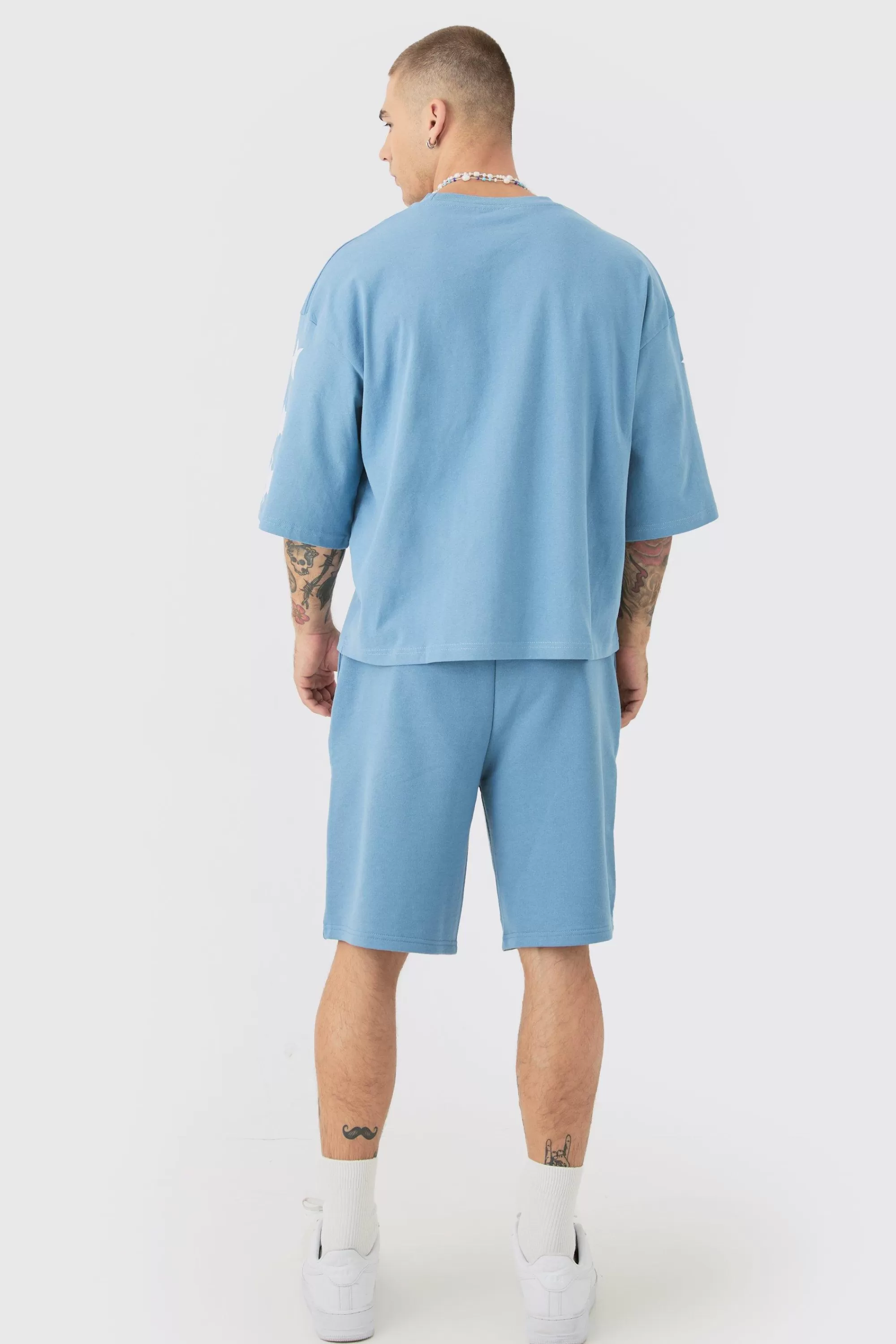 boohooMAN Oversized Boxy Varsity Half Sleeve T-shirt & Short Set | UK