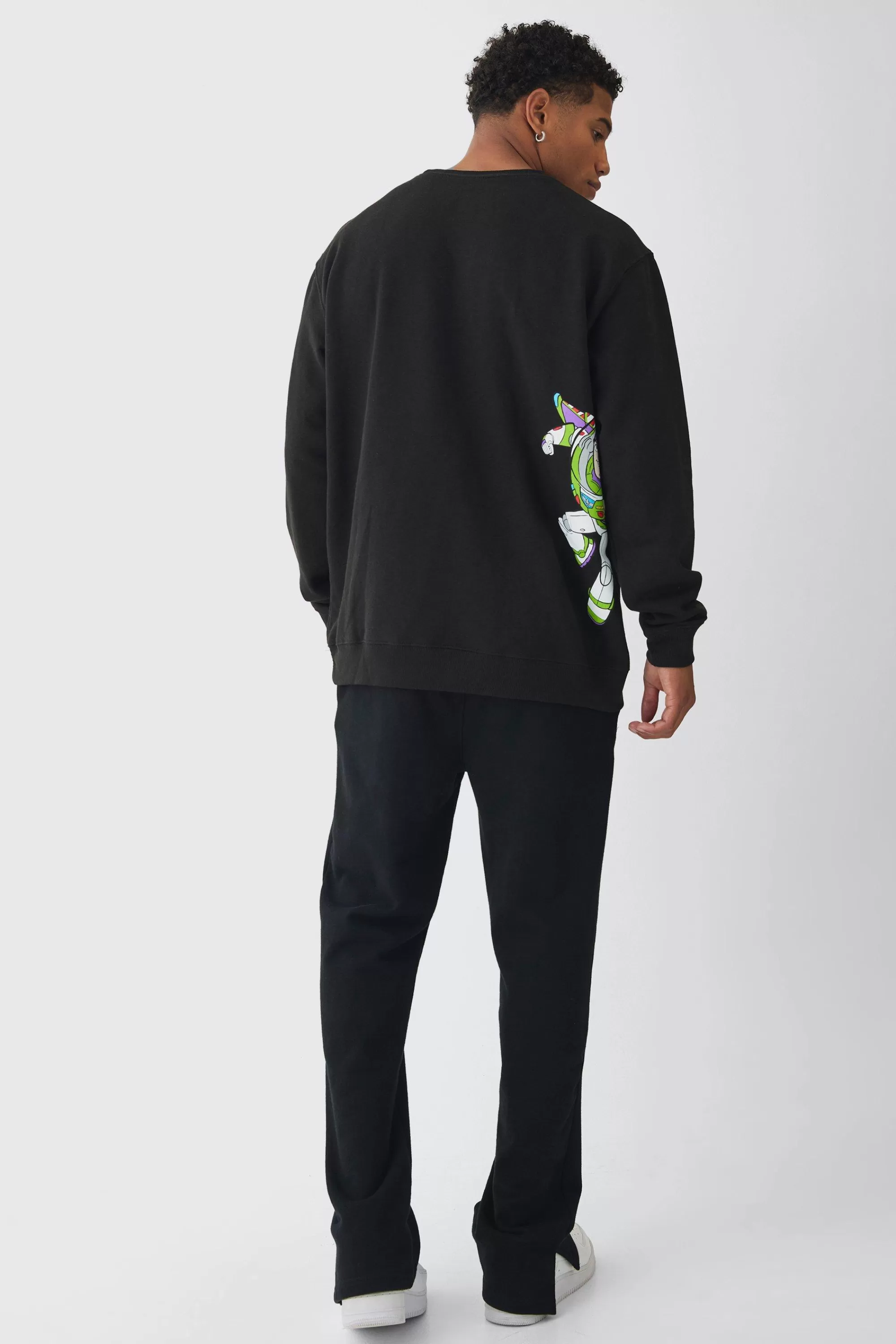 boohooMAN Oversized Buzz Lightyear Toy Story License Print Sweatshirt | UK