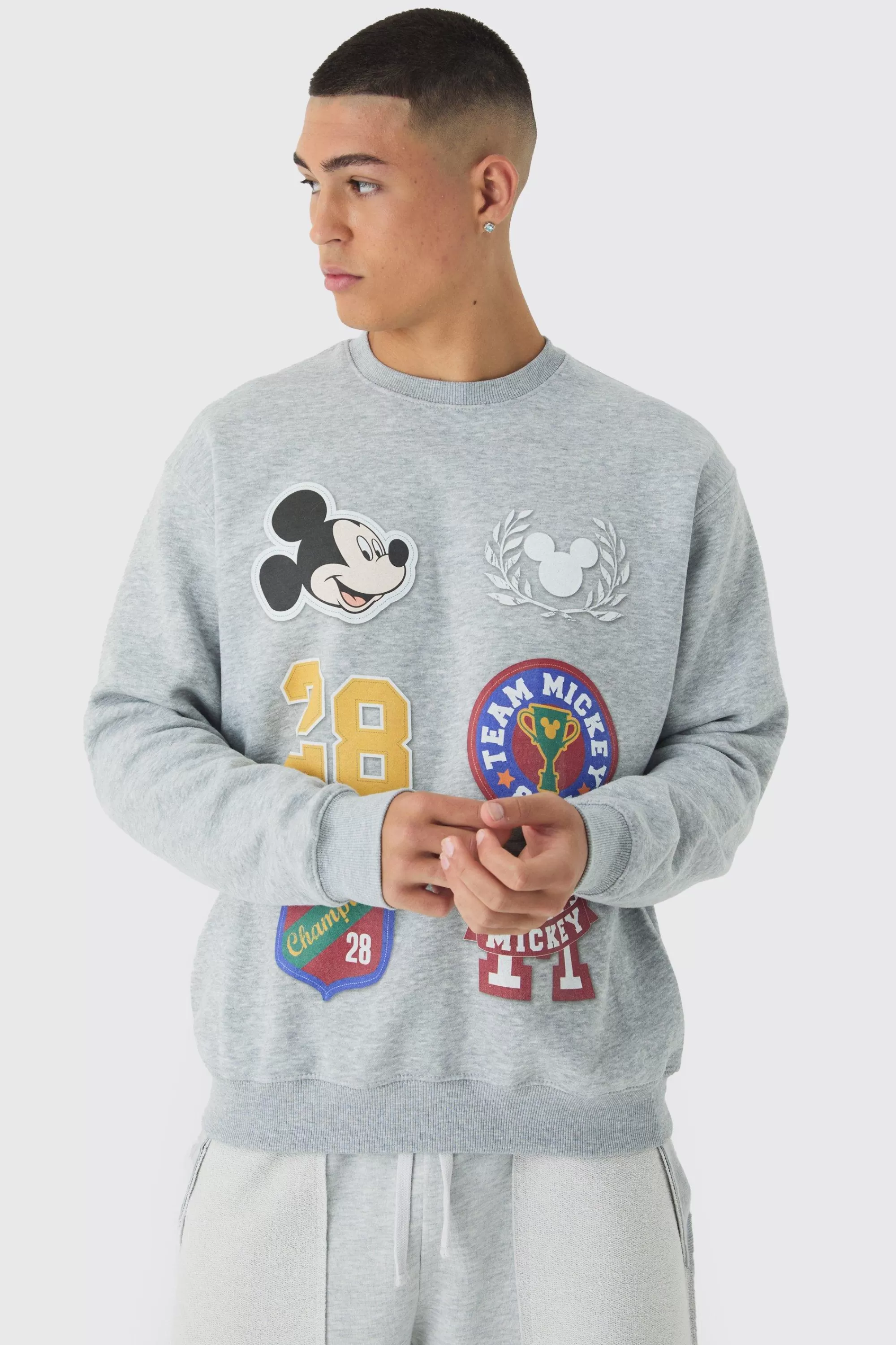 boohooMAN Oversized Disney Mickey Mouse Varsity License Print Sweatshirt | UK