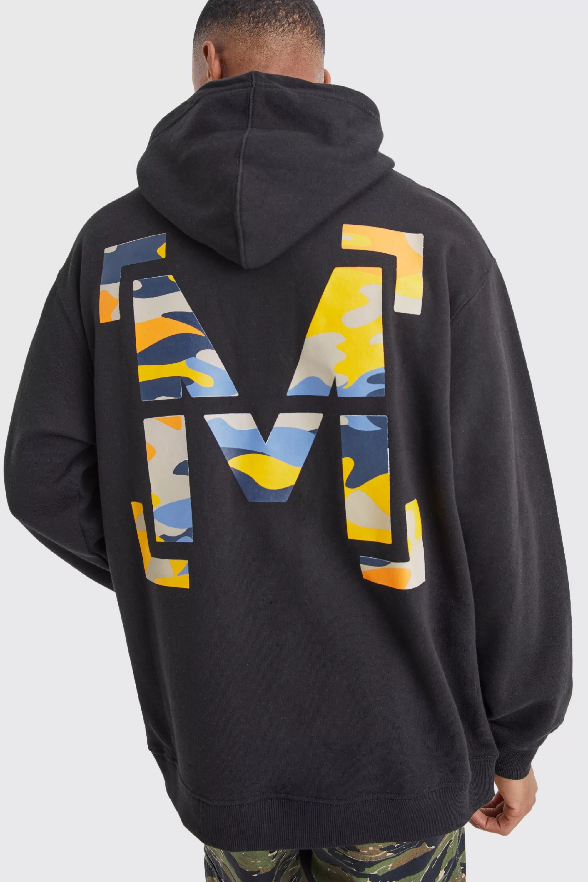 boohooMAN Oversized M Camo Graphic Hoodie | UK